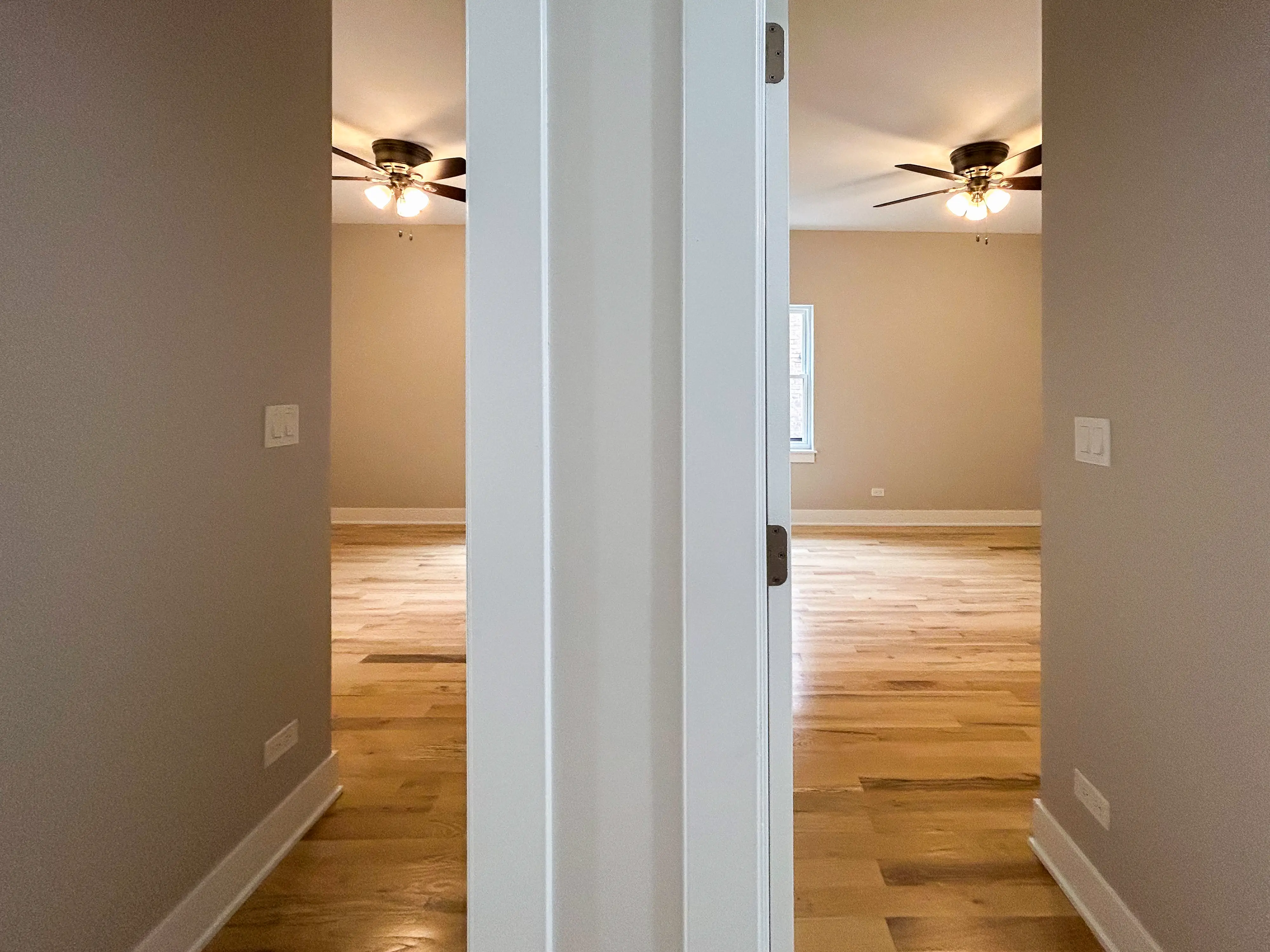 A composite image of open doors leading to empty rooms with ceiling fans