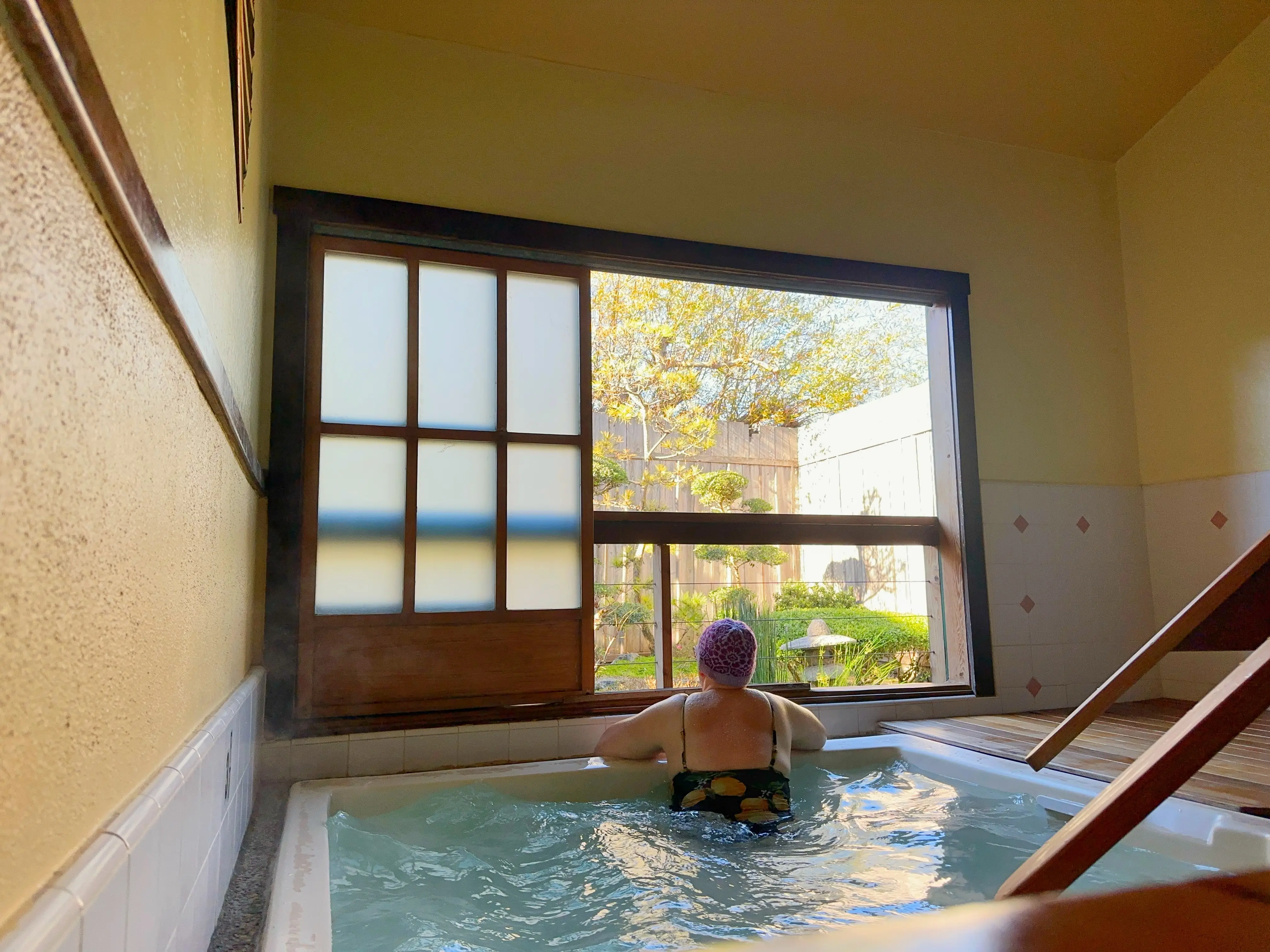 The author enjoys a soak in a hot tub.