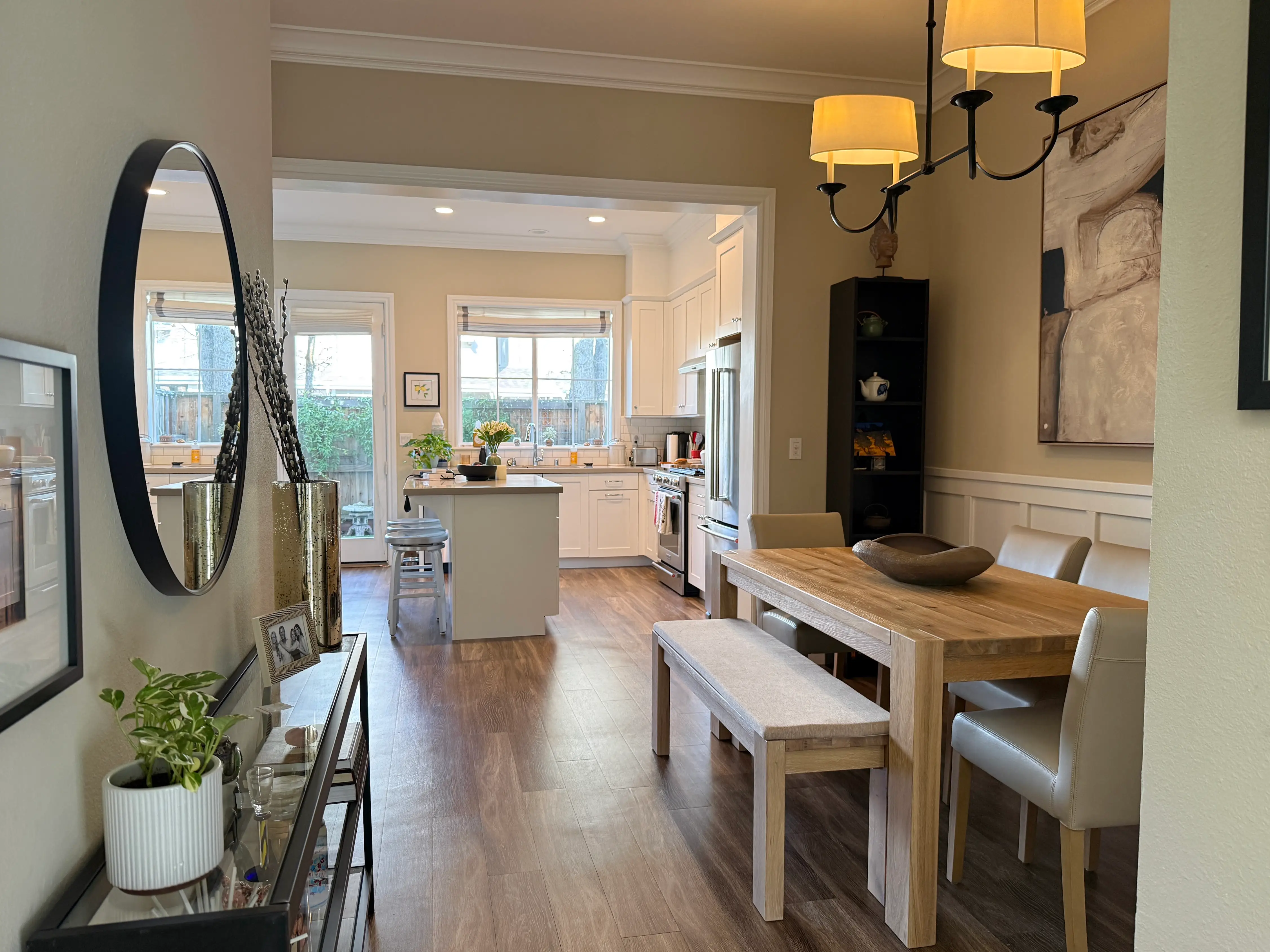 Kitchen and dining room area in home with wood floors