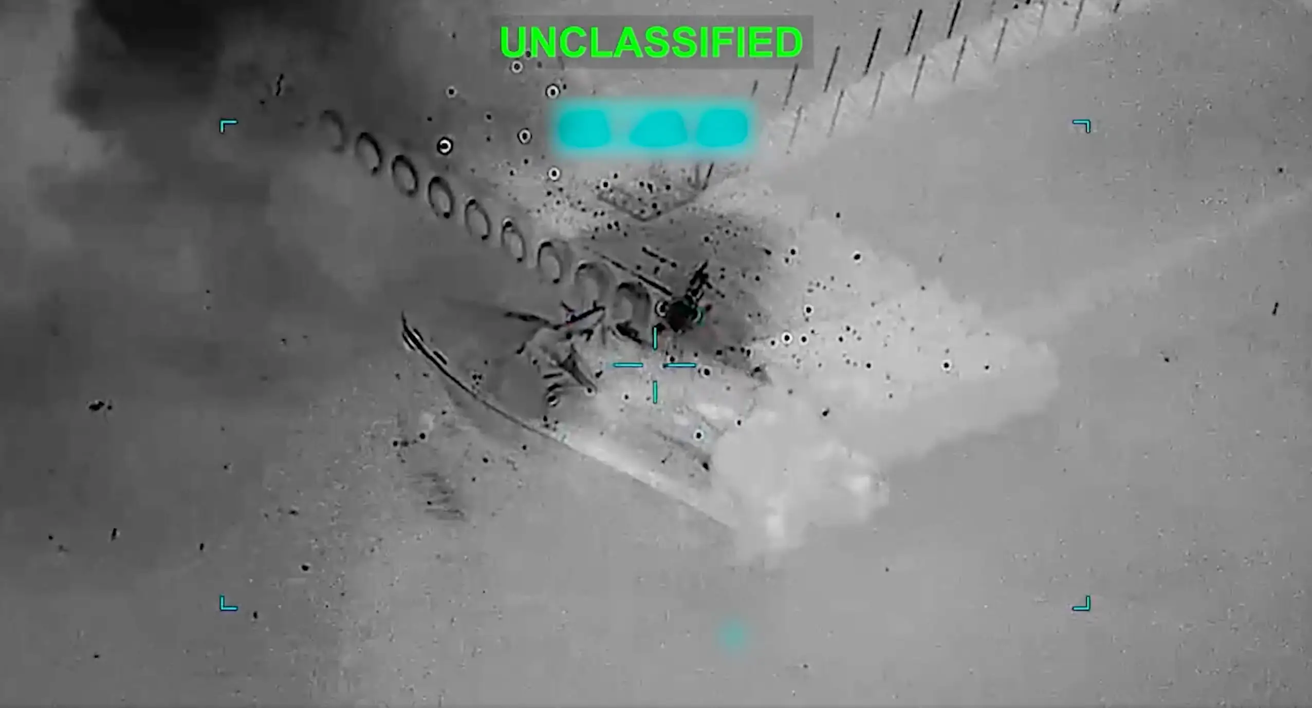 Footage appears to show a small boat being struck by an American munition.