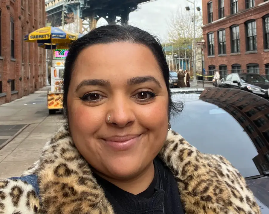 The writer posing for a selfie on a solo trip to New York.