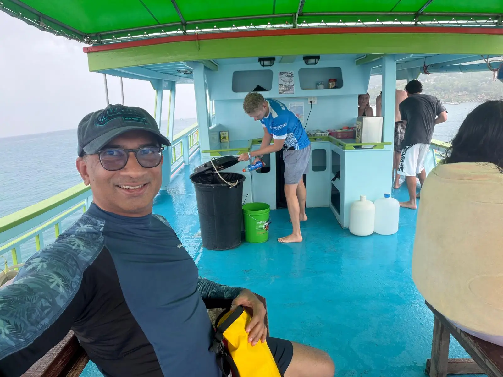 A man posing on a diving boat in Koh Tao.