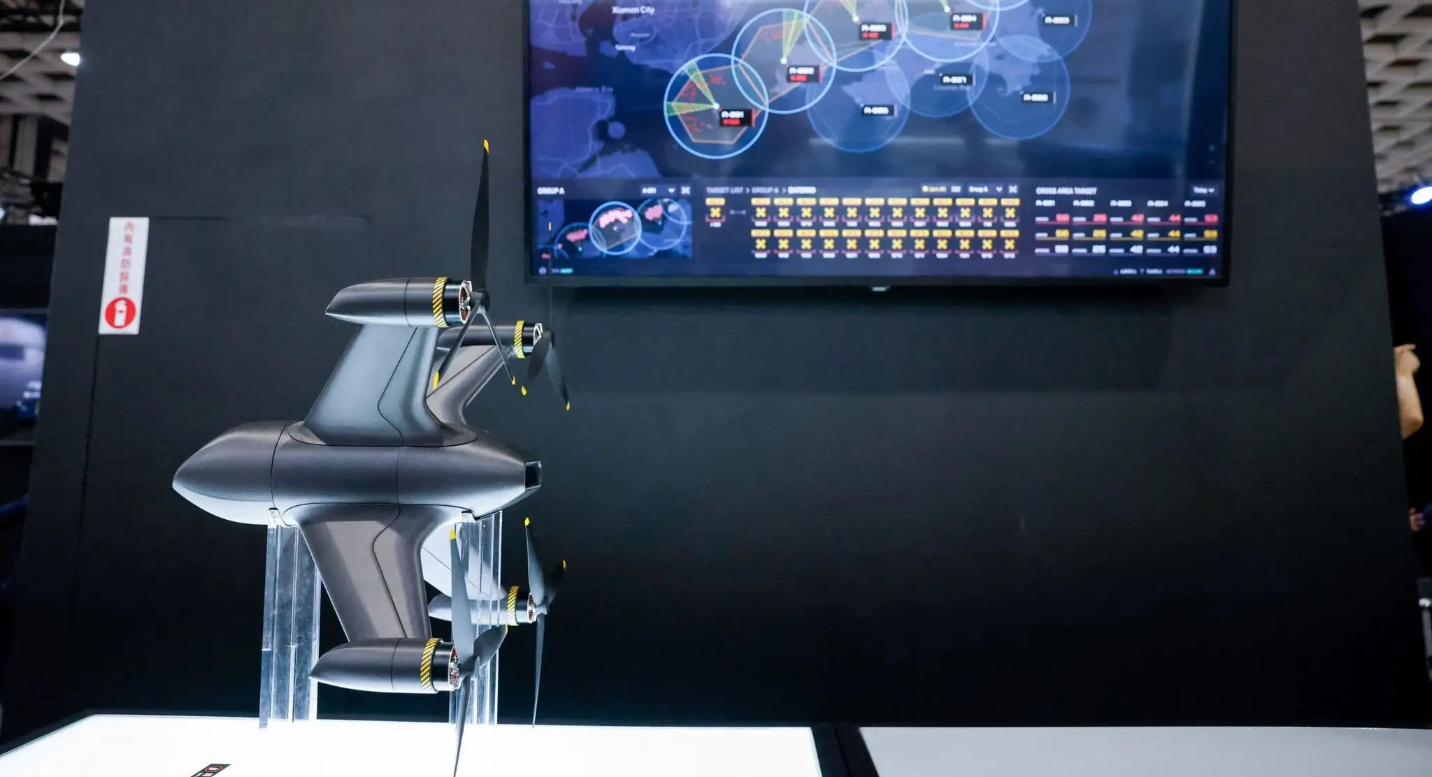 A quadcopter interceptor built by Tron Future sits on display.