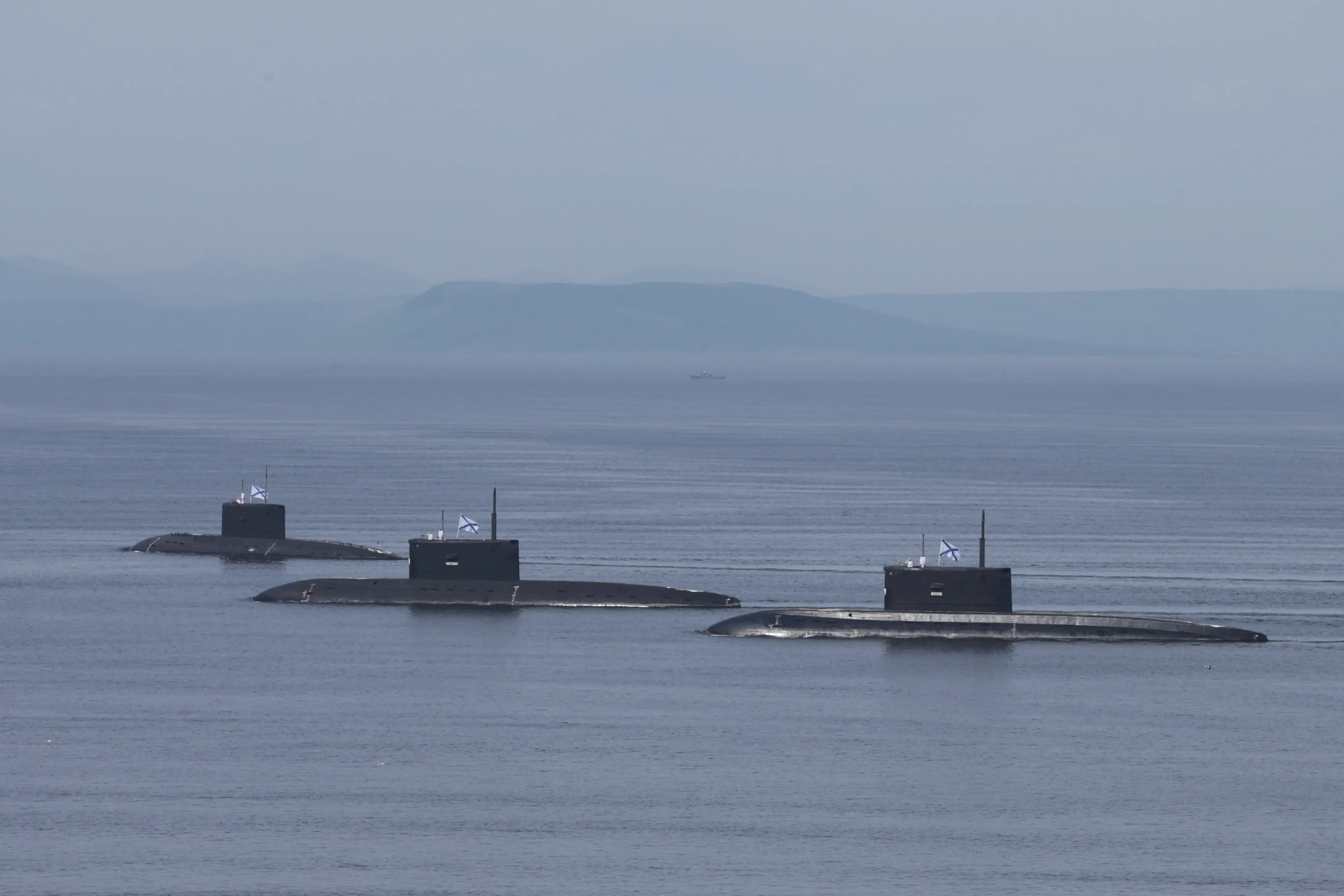 Russian submarines sail during the annual Navy Day parade in the far eastern port city of Vladivostok, Russia, July 30, 2023.