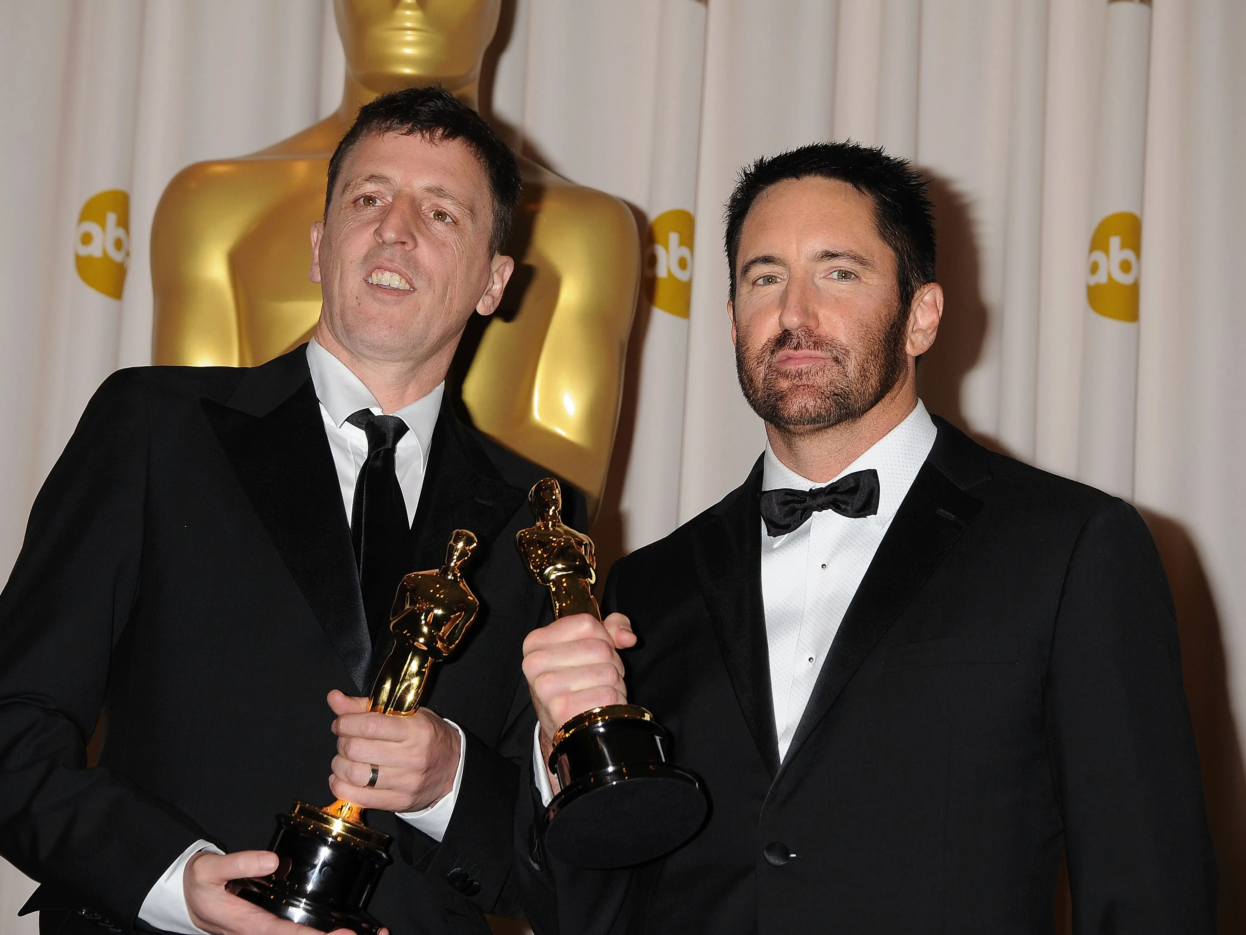 Atticus Ross and Trent Reznor pose in the press room during the 83rd Annual Academy Awards held at the Kodak Theatre on February 27, 2011 in Hollywood, California.