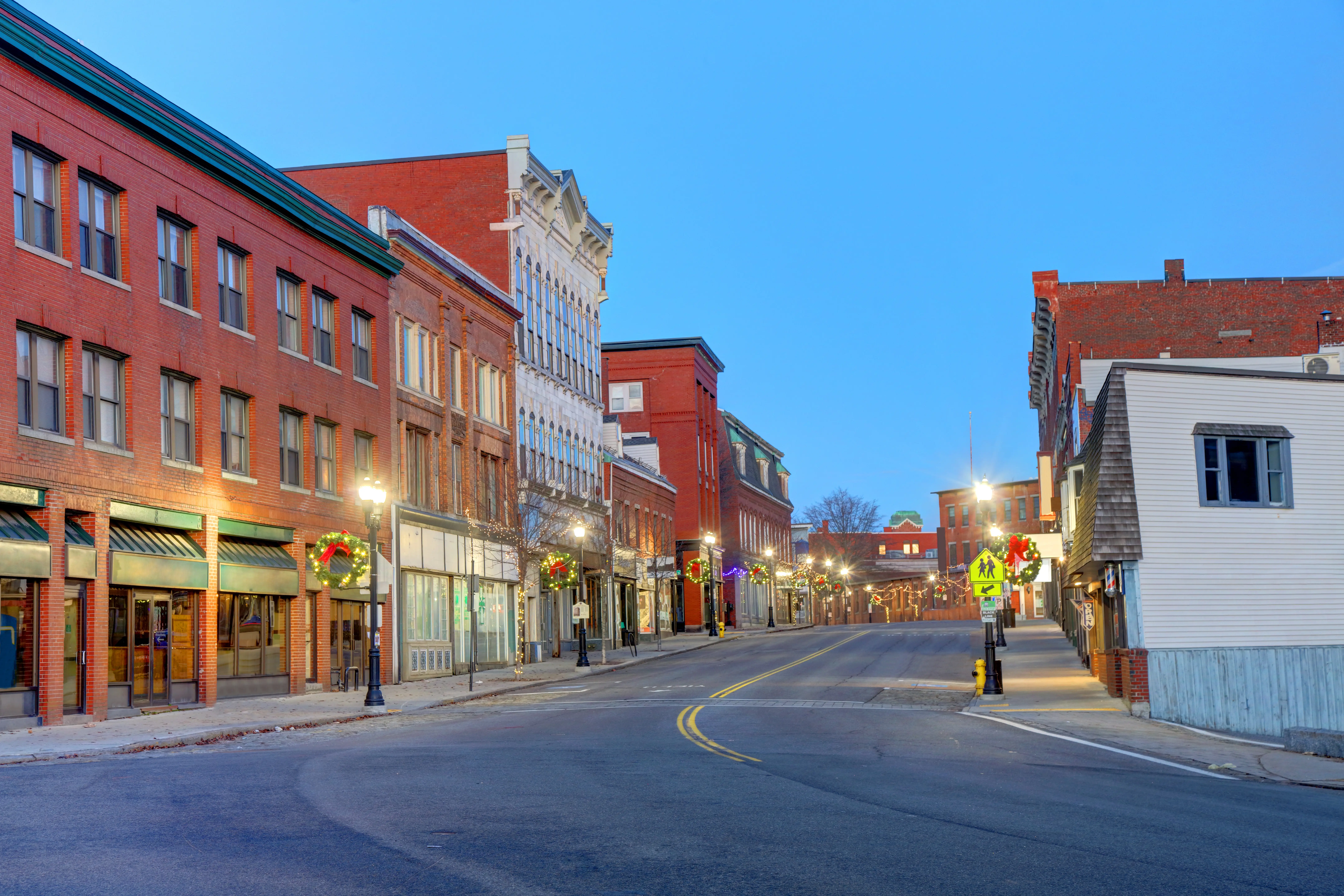 A street with storefronts in Biddeford, Maine.