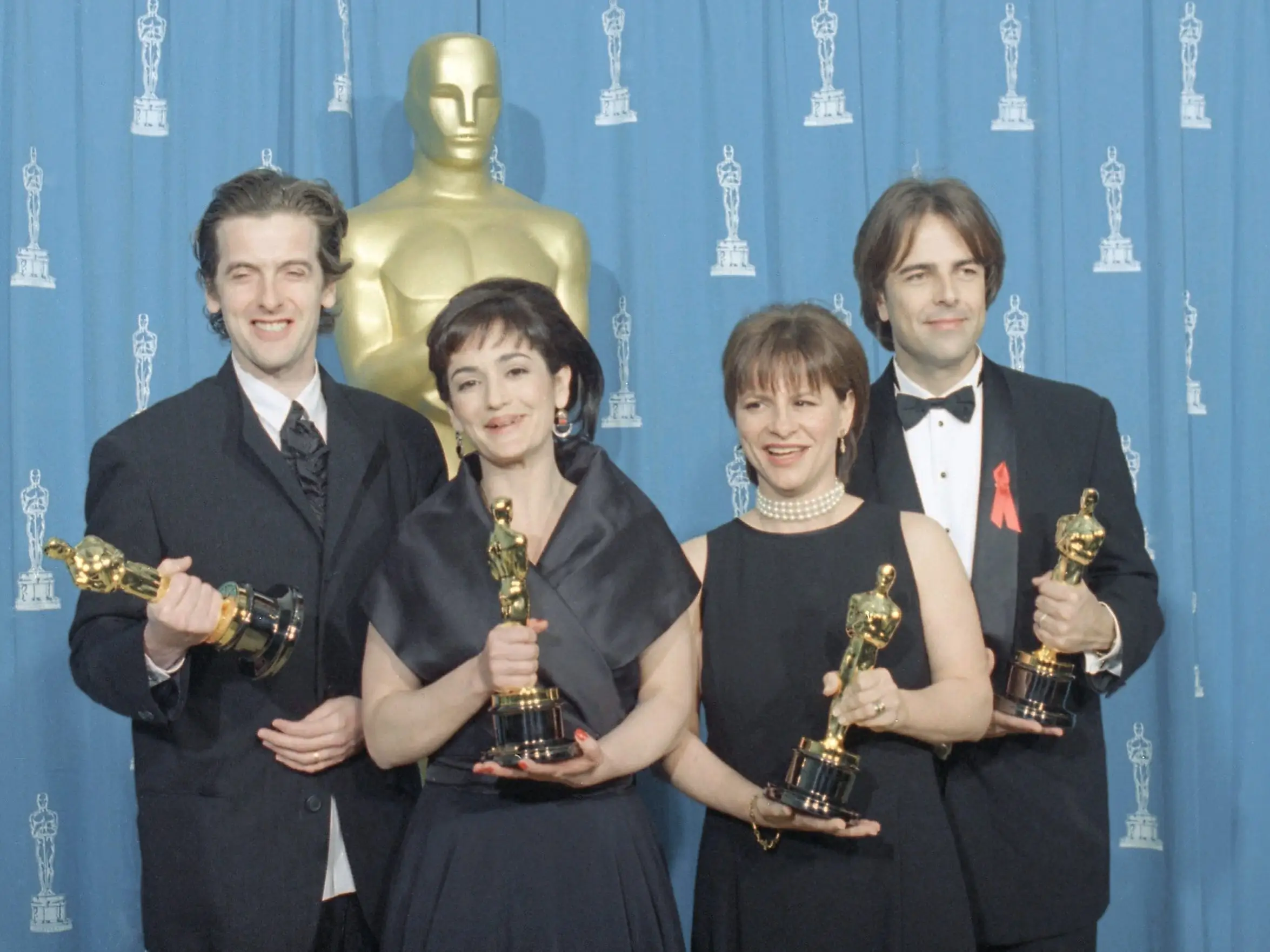 Best live action short film winners Peter Capaldi, Ruth Kenley-Letts, Peggy Rajski, and Randy Stone posed with their awards in 1995.
