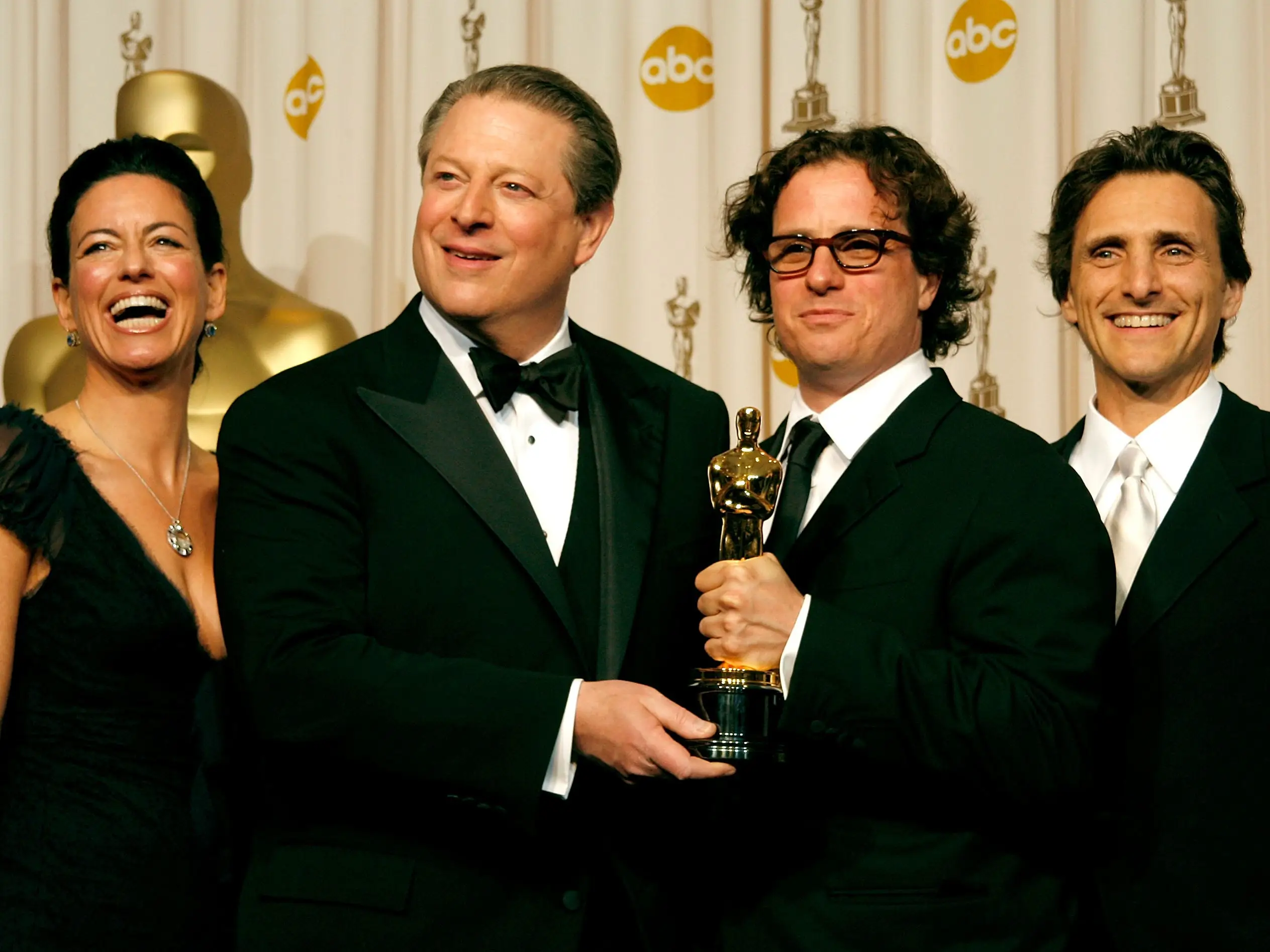 Producer Laurie David, former vice president Al Gore, director Davis Guggenheim, and producer Lawrence Bender pose with the Oscar for best documentary feature in 2007.