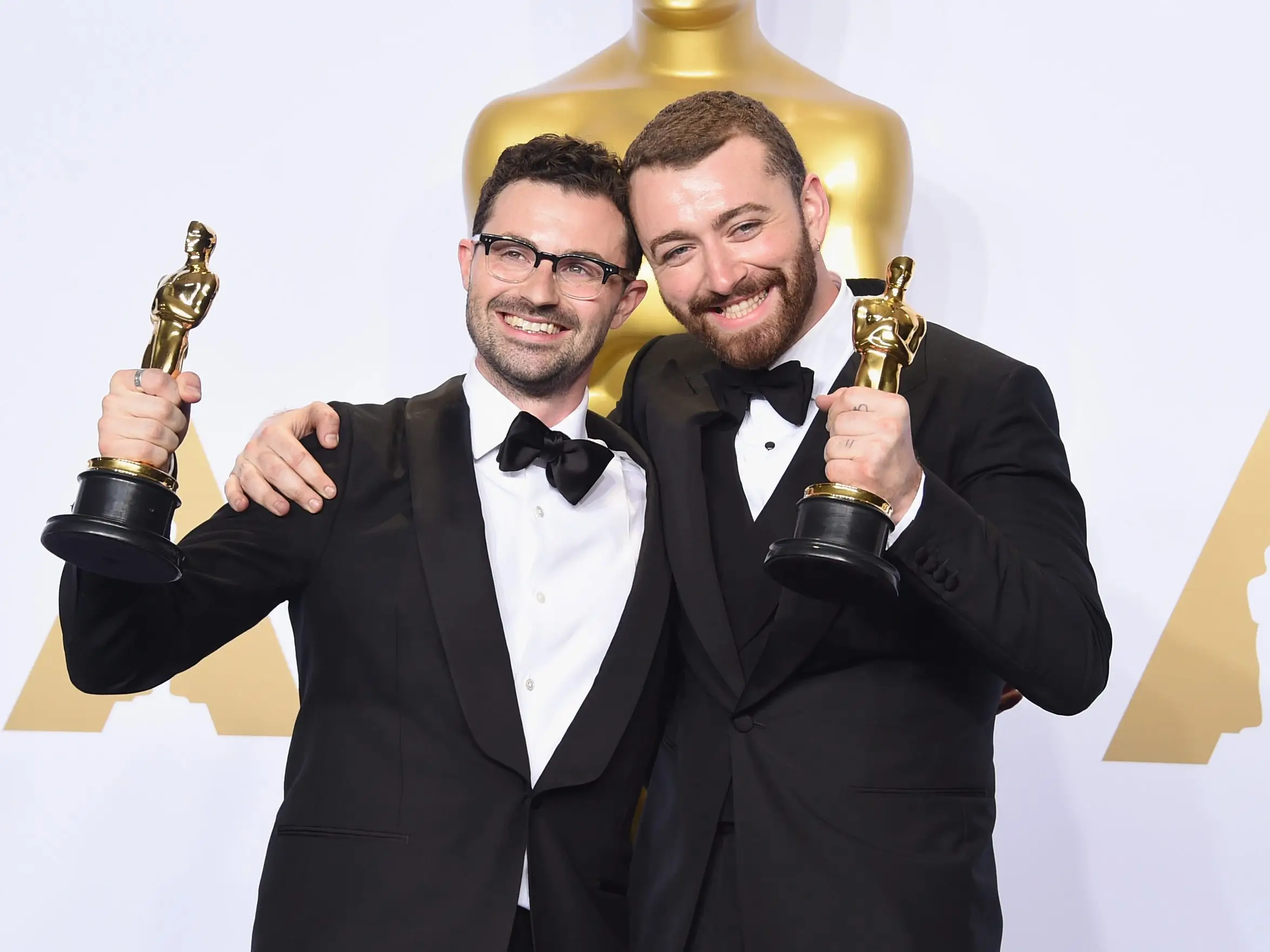 Songwriter Jimmy Napes (L) and singer Sam Smith, winners of the award for Best Original Song 'Writing's on the Wall,' pose in the press room during the 88th Annual Academy Awards.