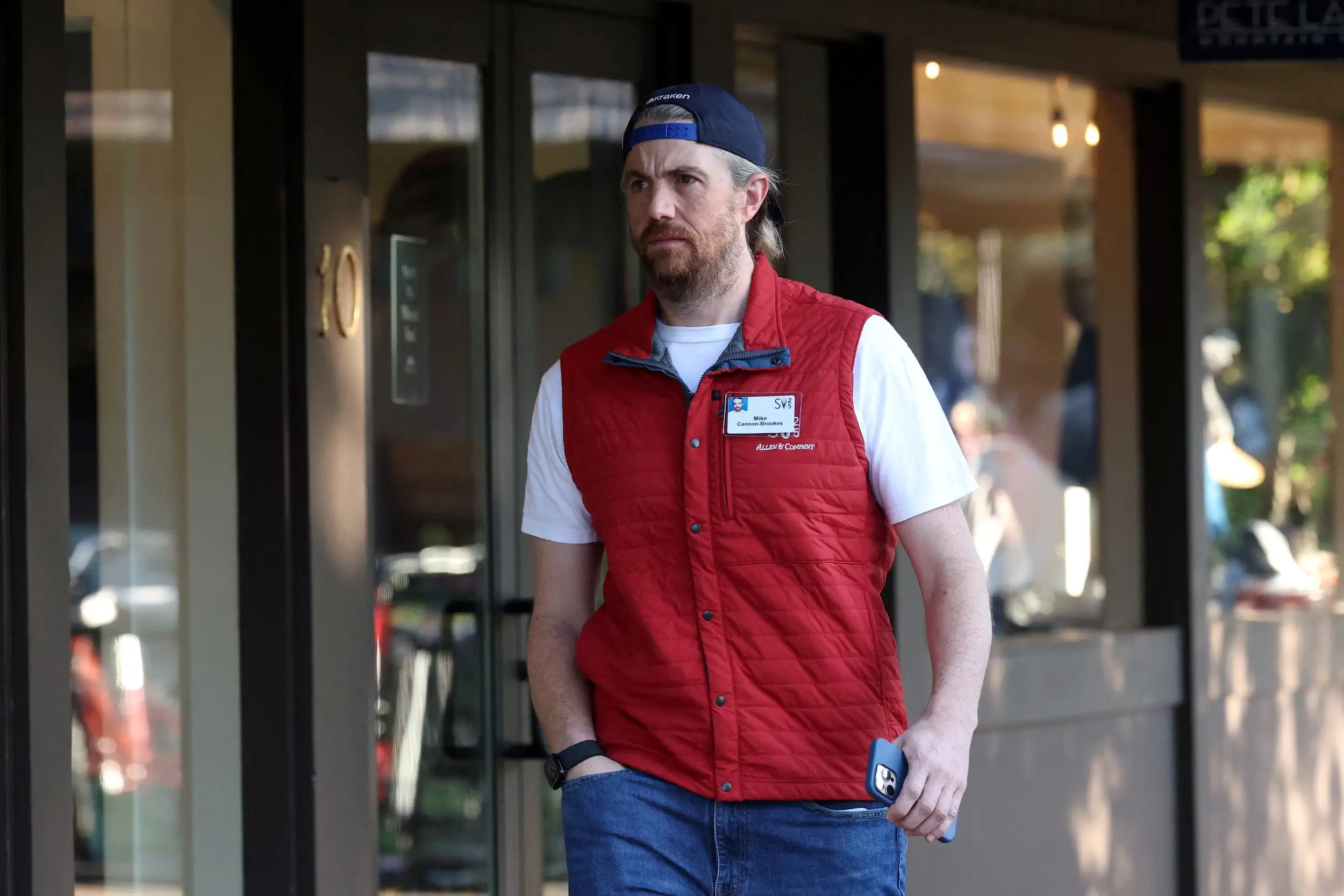 Mike Cannon-Brookes walks around during the annual media and tech conference in Sun Valley