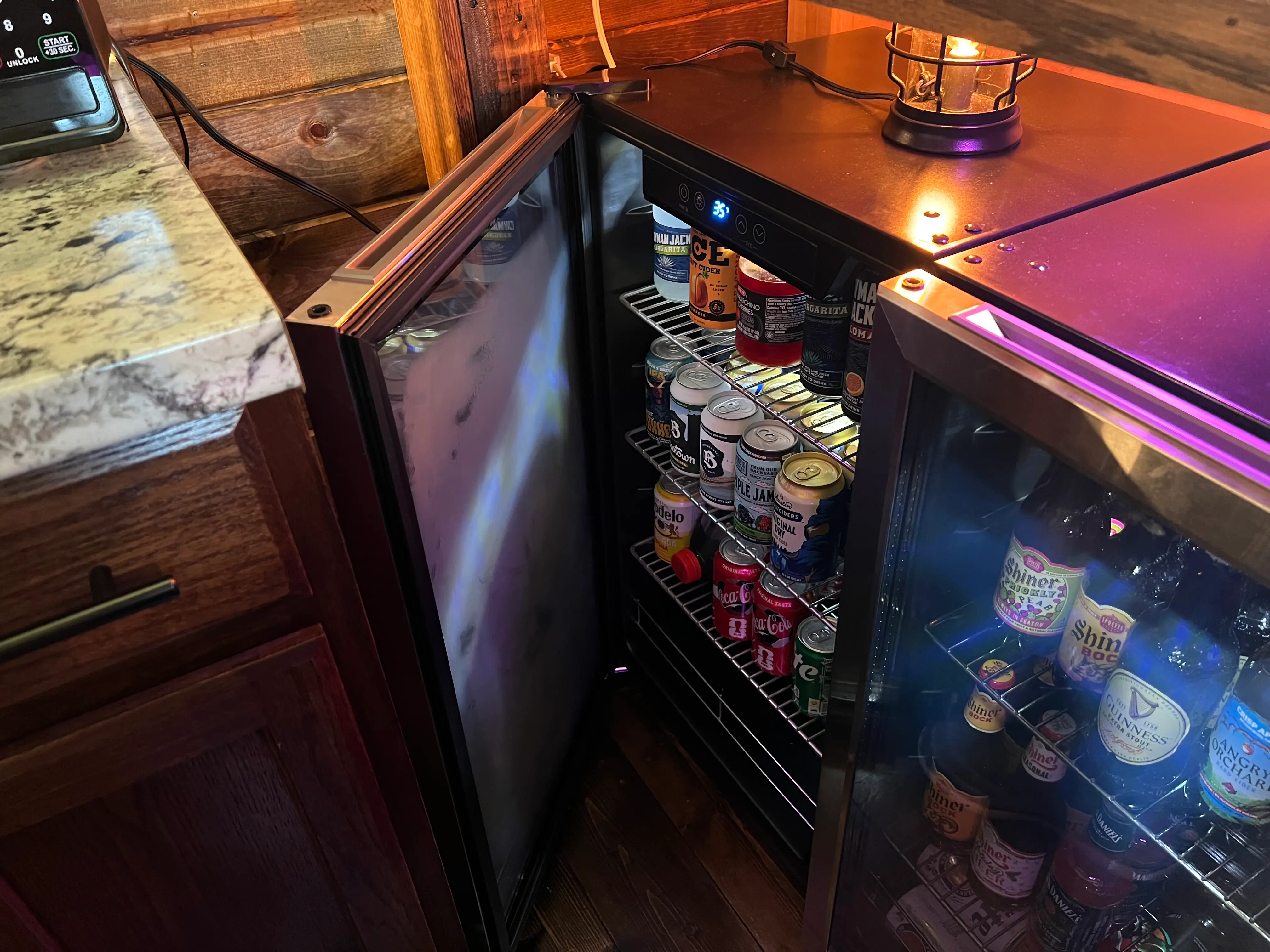 The two mini fridges inside Stephen Hutyra's backyard pub.