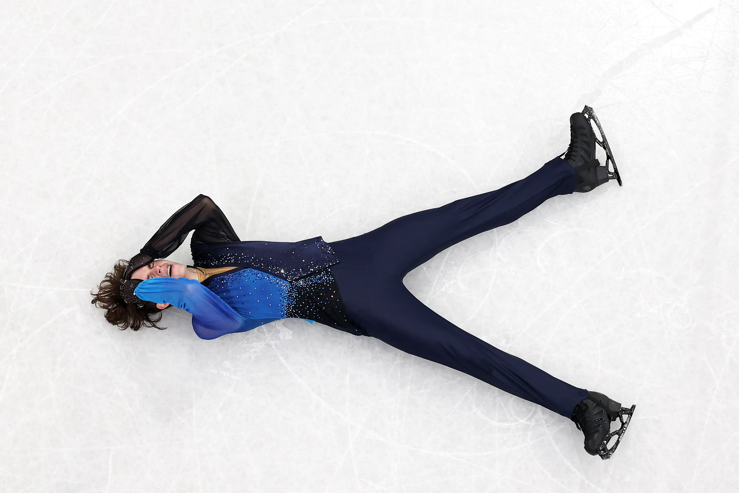 Mikhail Shaidorov of Team Kazakhstan reacts after competing in the Men Single Skating on day seven of the Milano Cortina 2026 Winter Olympic games at Milano Ice Skating Arena on February 13, 2026
