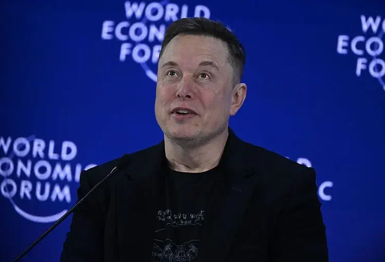 Elon Musk says Tesla expects to increase its human workforce as AI and robotics boost productivity
