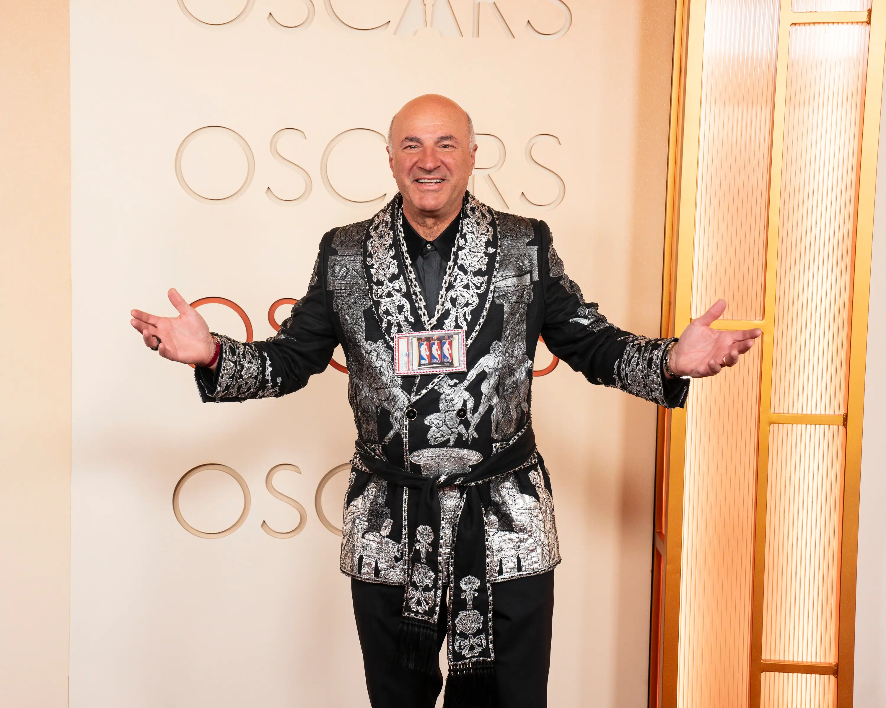 Kevin O'Leary with a card chain around his chest