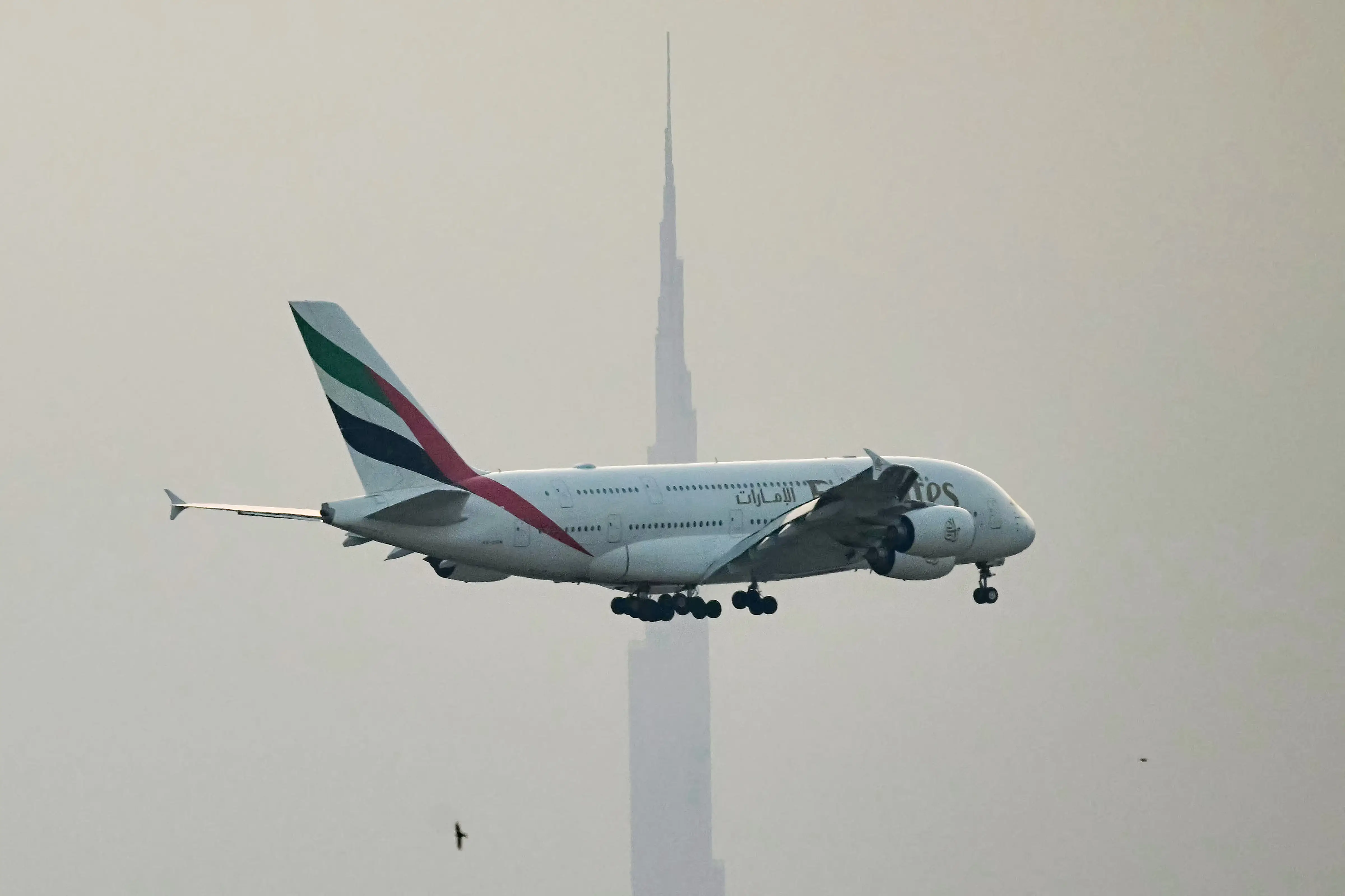 An Emirates Airbus A380 passenger aircraft prepares for landing at Dubai International Airport in Dubai on March 8, 2026.