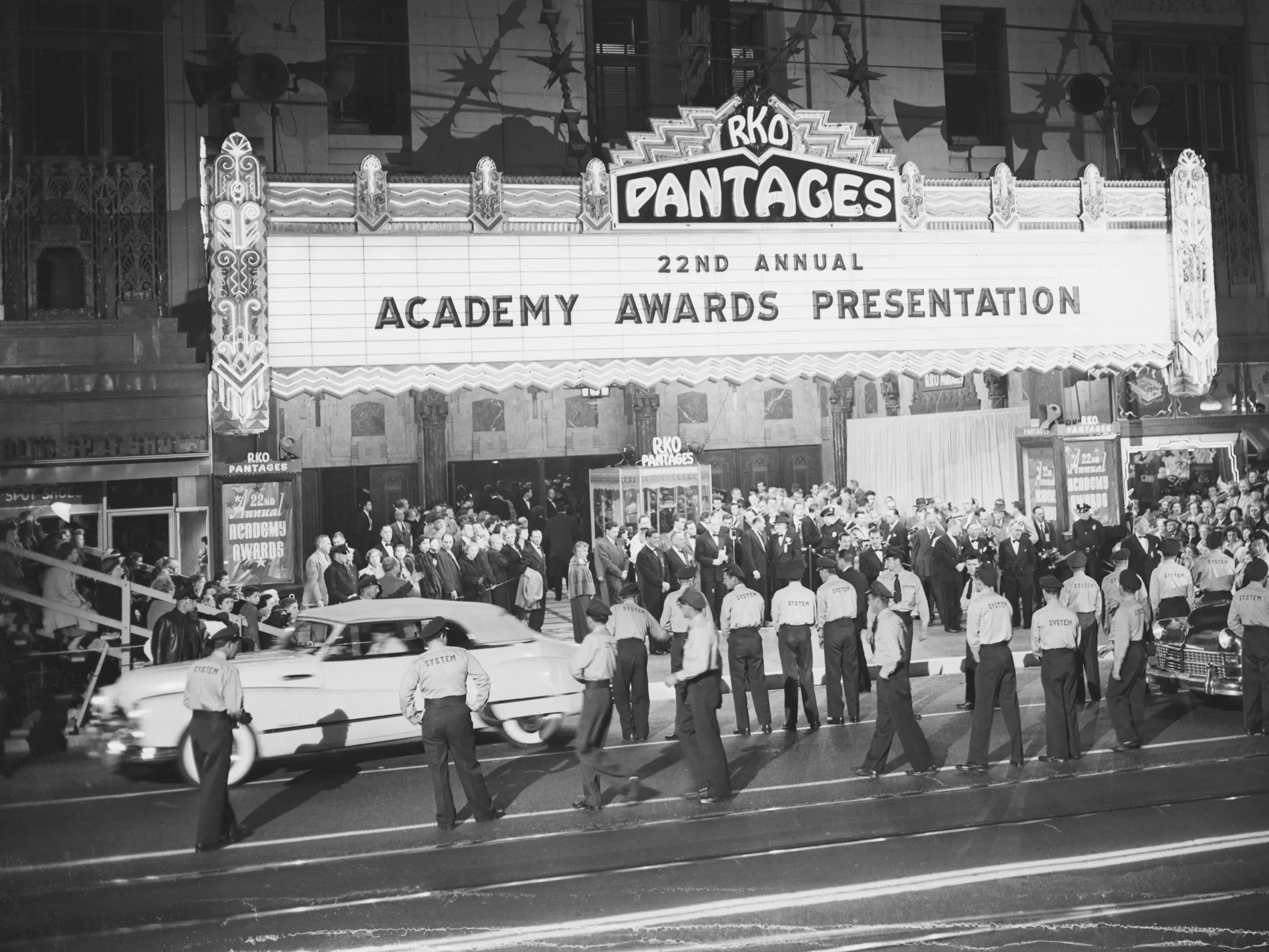 Parking lot attendants stand by to assist film capital celebrities as they arrive for the 22nd annual awards show.