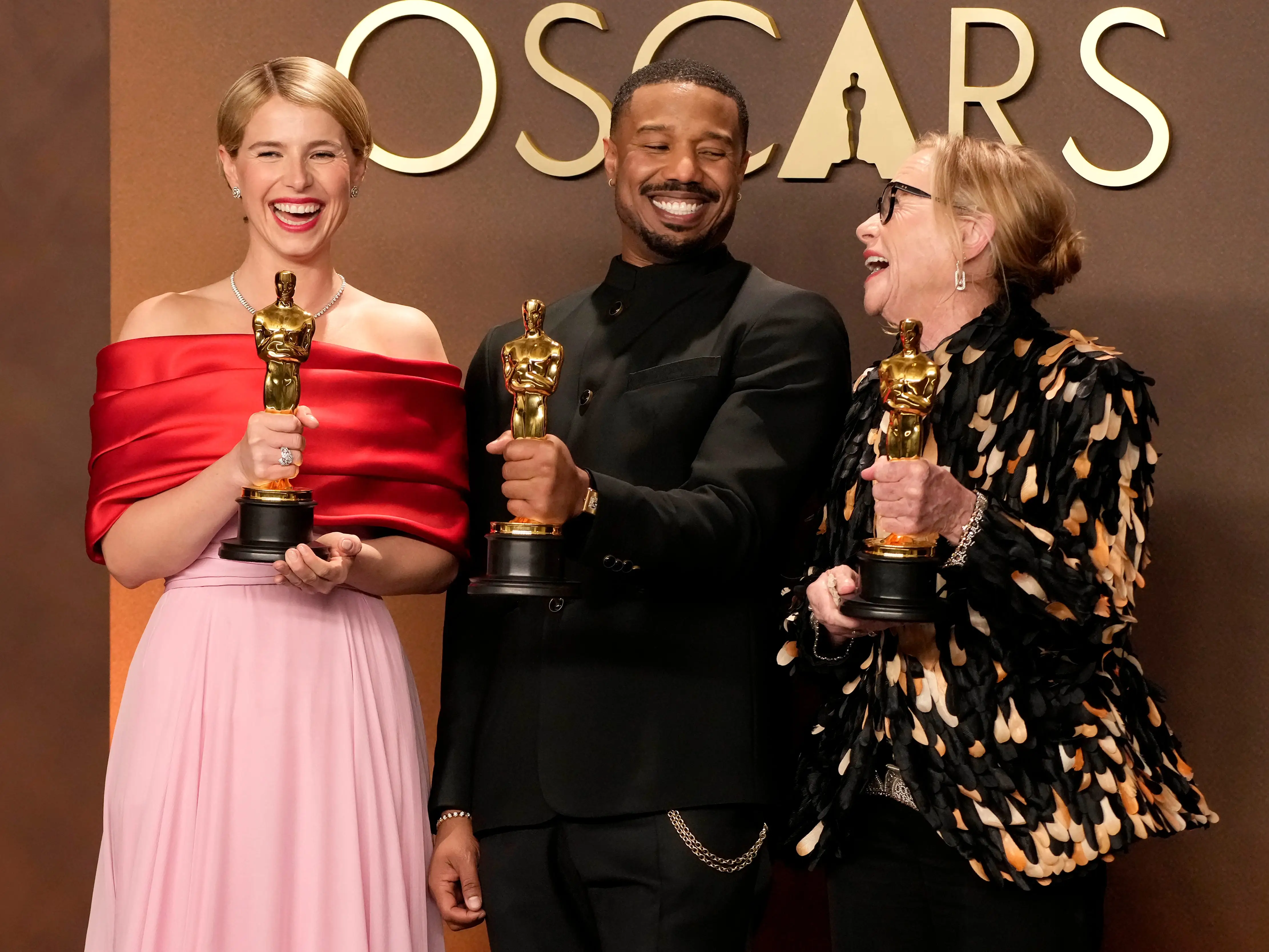 Jessie Buckley, Michael B. Jordan, and Amy Madiganall pose with their Oscars.