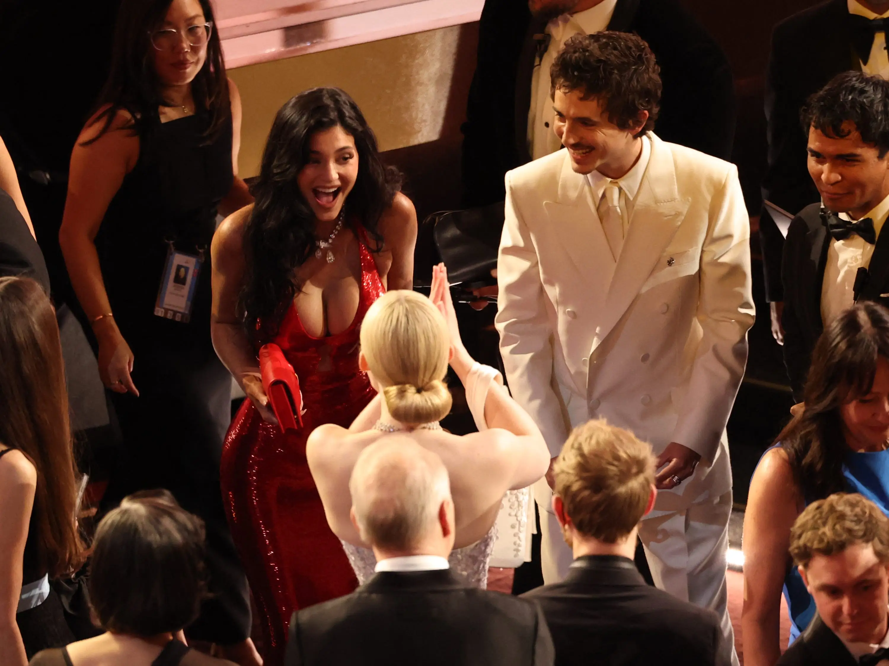 Kylie Jenner and Timothée Chalamet greet Elle Fanning at the Oscars in March 2026.