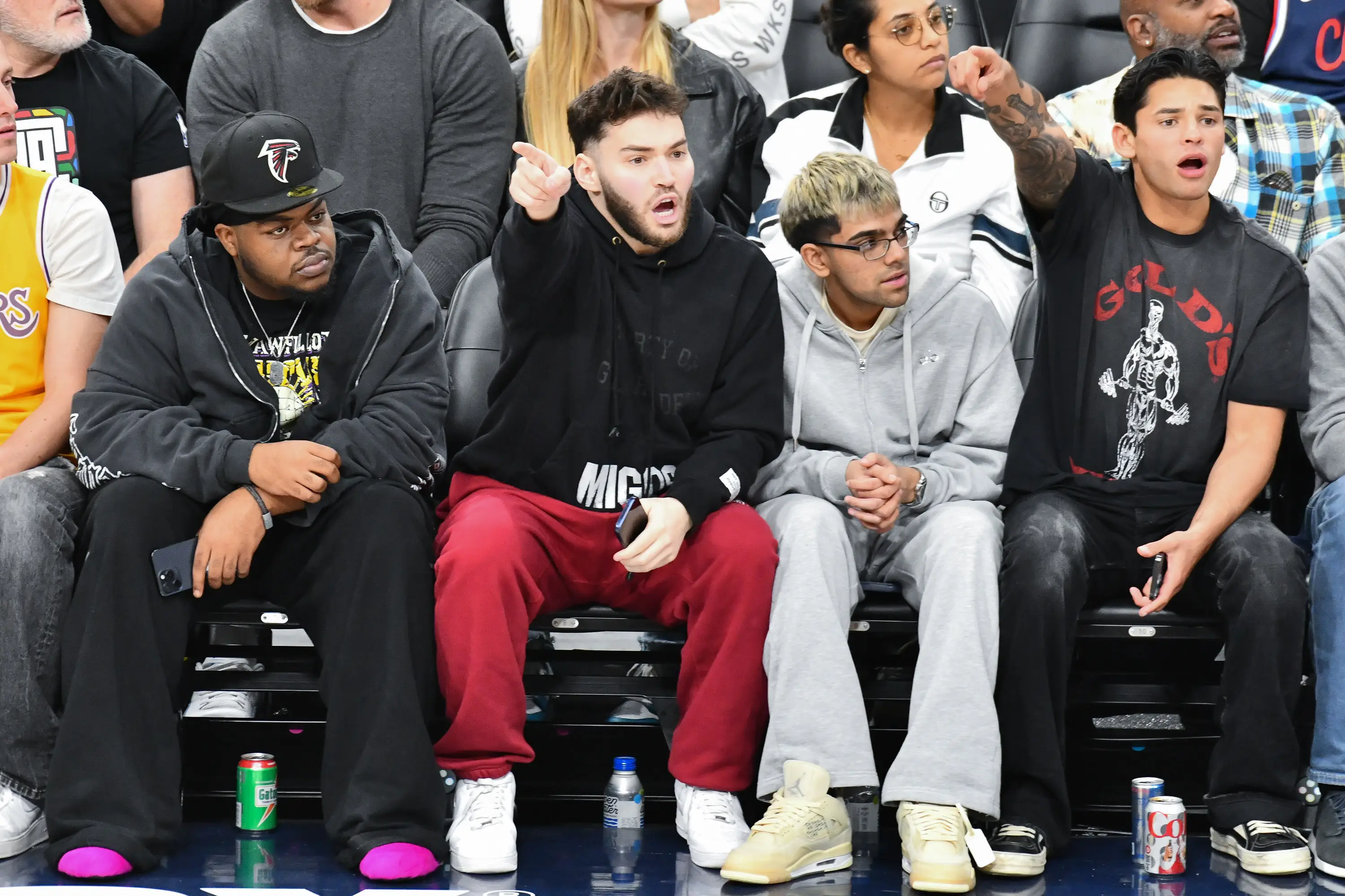 Adin Ross and N3on, center, known for their inflammatory comments, found popularity on Kick.