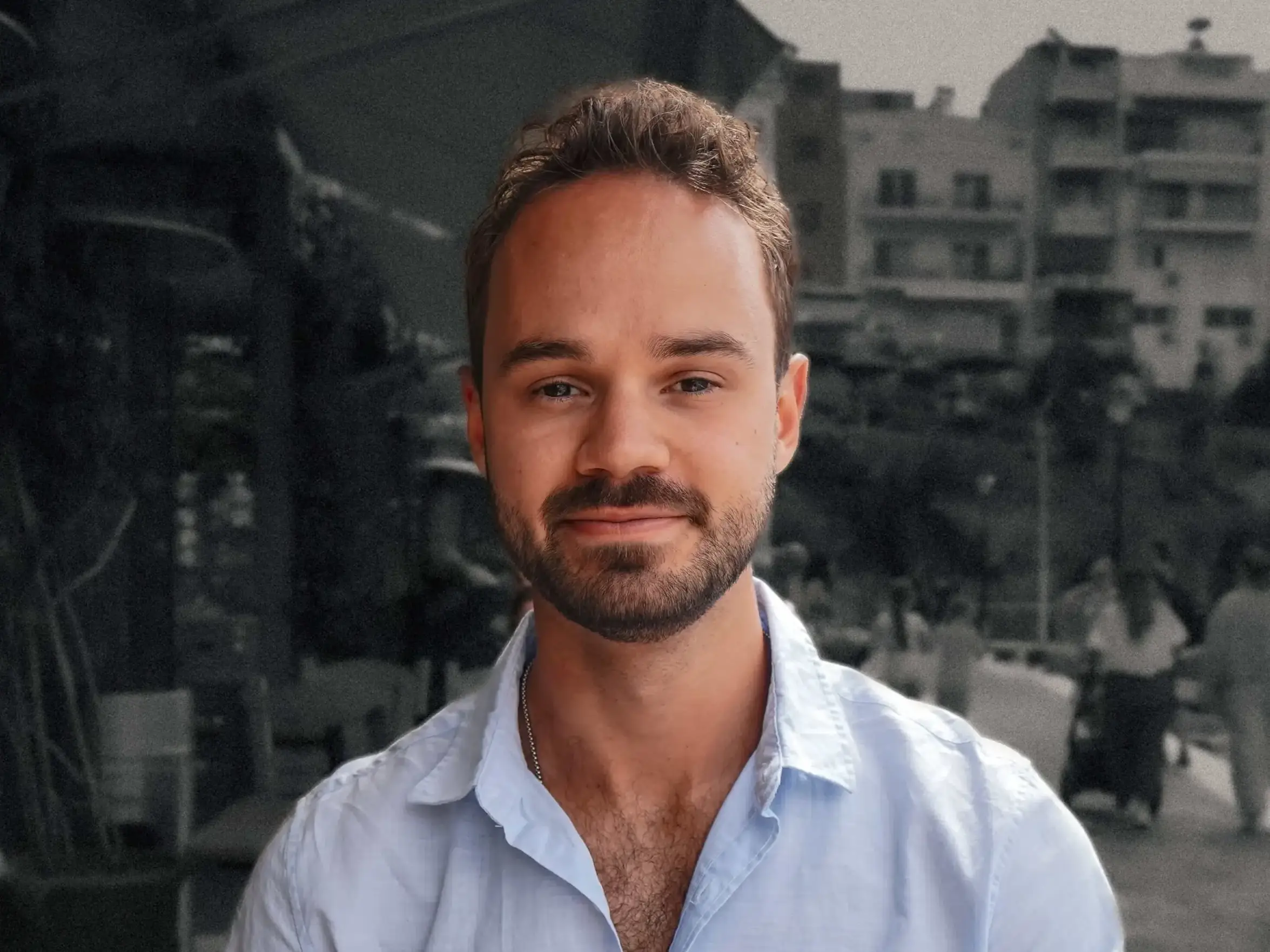 headshot of a man with a black and white background