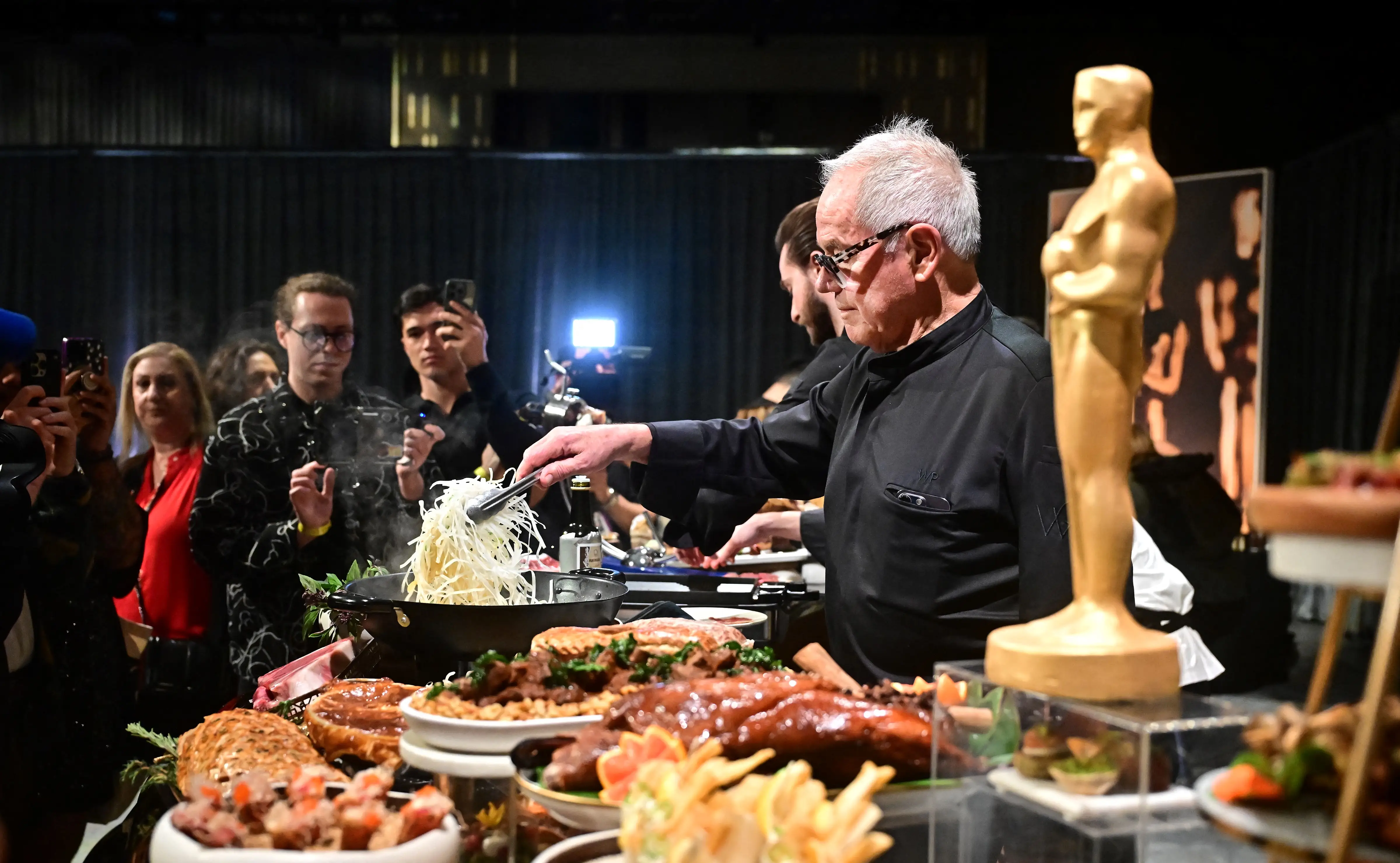 Wolfgang Puck serving food at the 2025 Oscars.