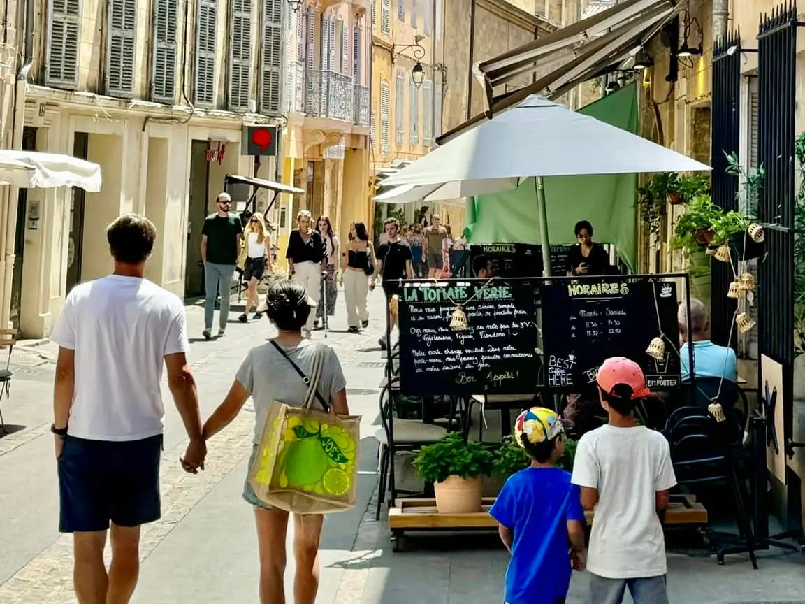 A family, a man, a wife, and two young boys, walking around the streets of France.