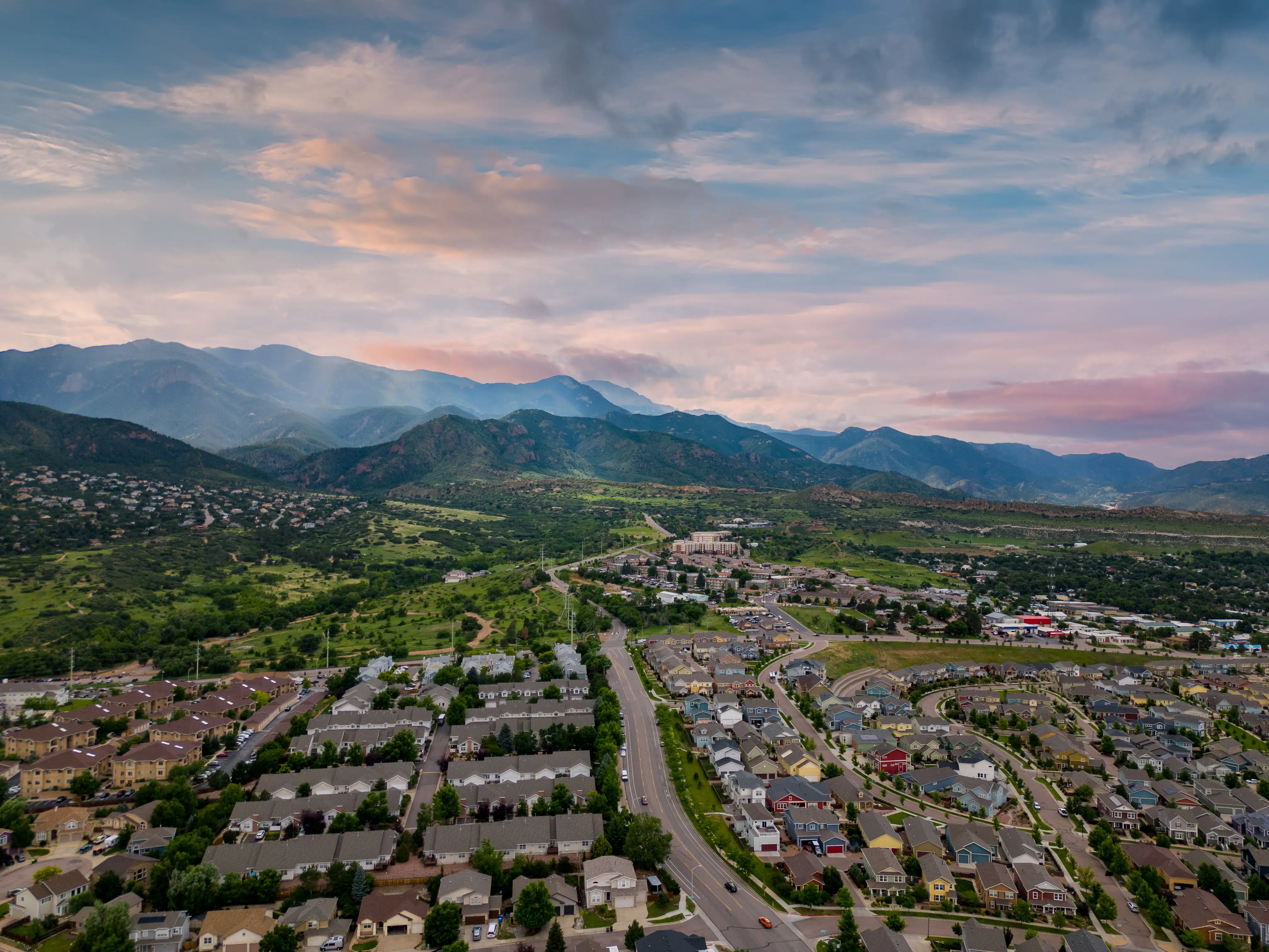 Aerial photo of Colorado Springs, Colorado, residential neighborhoods near mountain ranges.