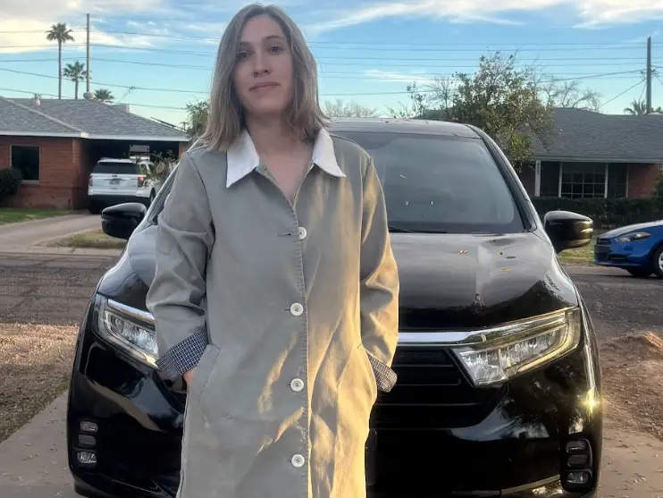 Krisann Valdez in front of her new car