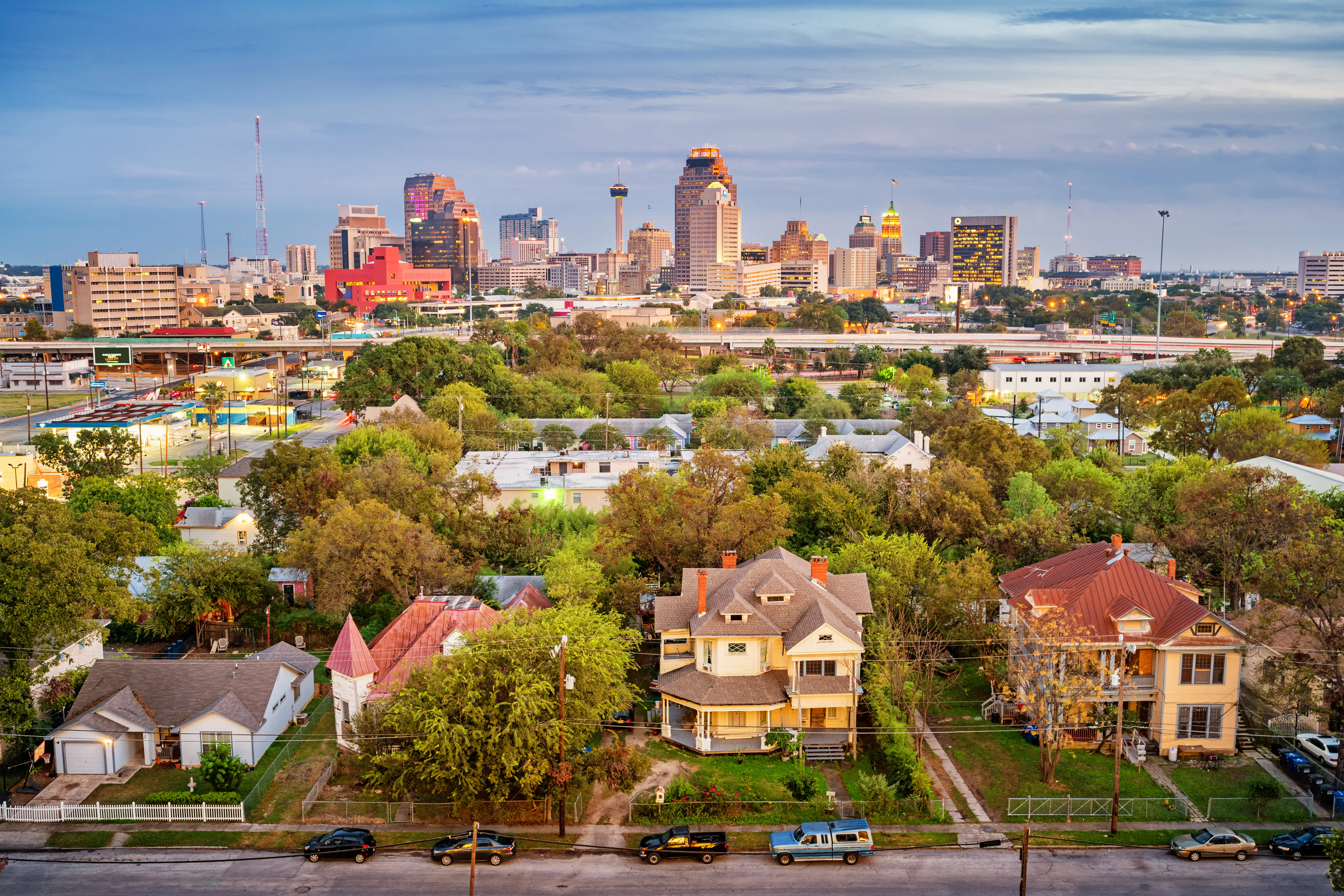Aerial view of a residential district and the downtown skyline of San Antonio.