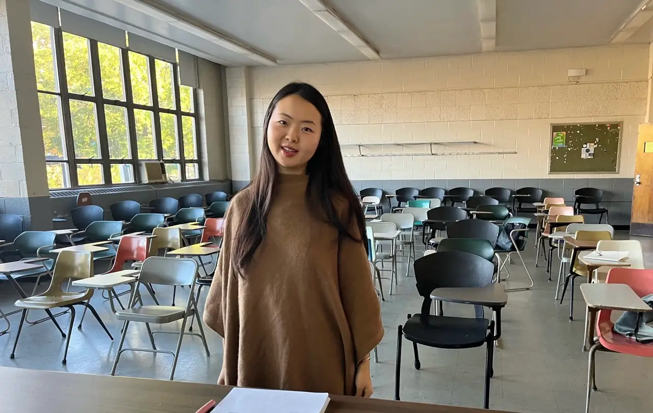 Woman standing in classroom