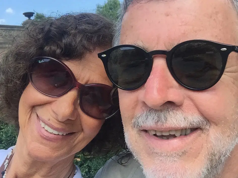 A senior man and woman wearing sunglasses