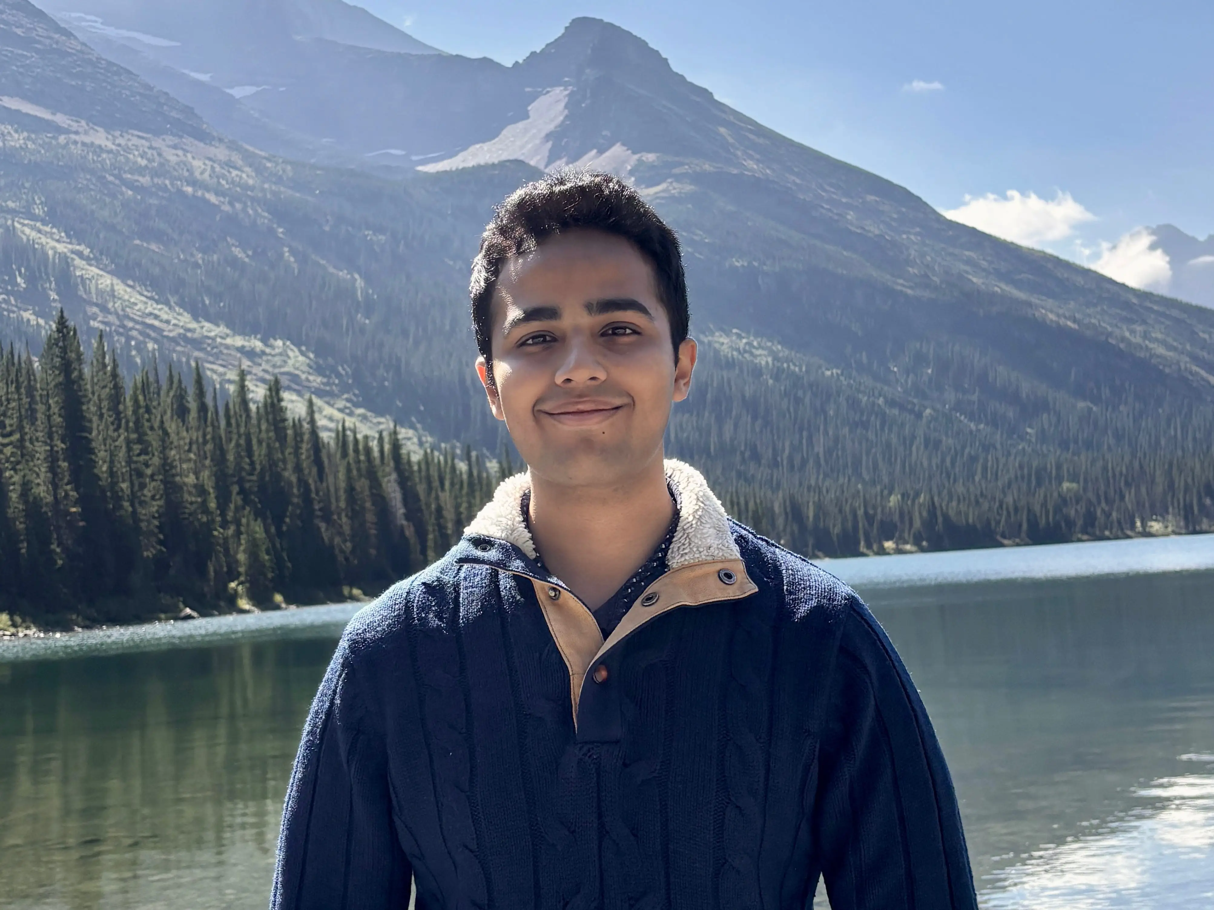 Kanav Bhatnagar standing in front of a mountain