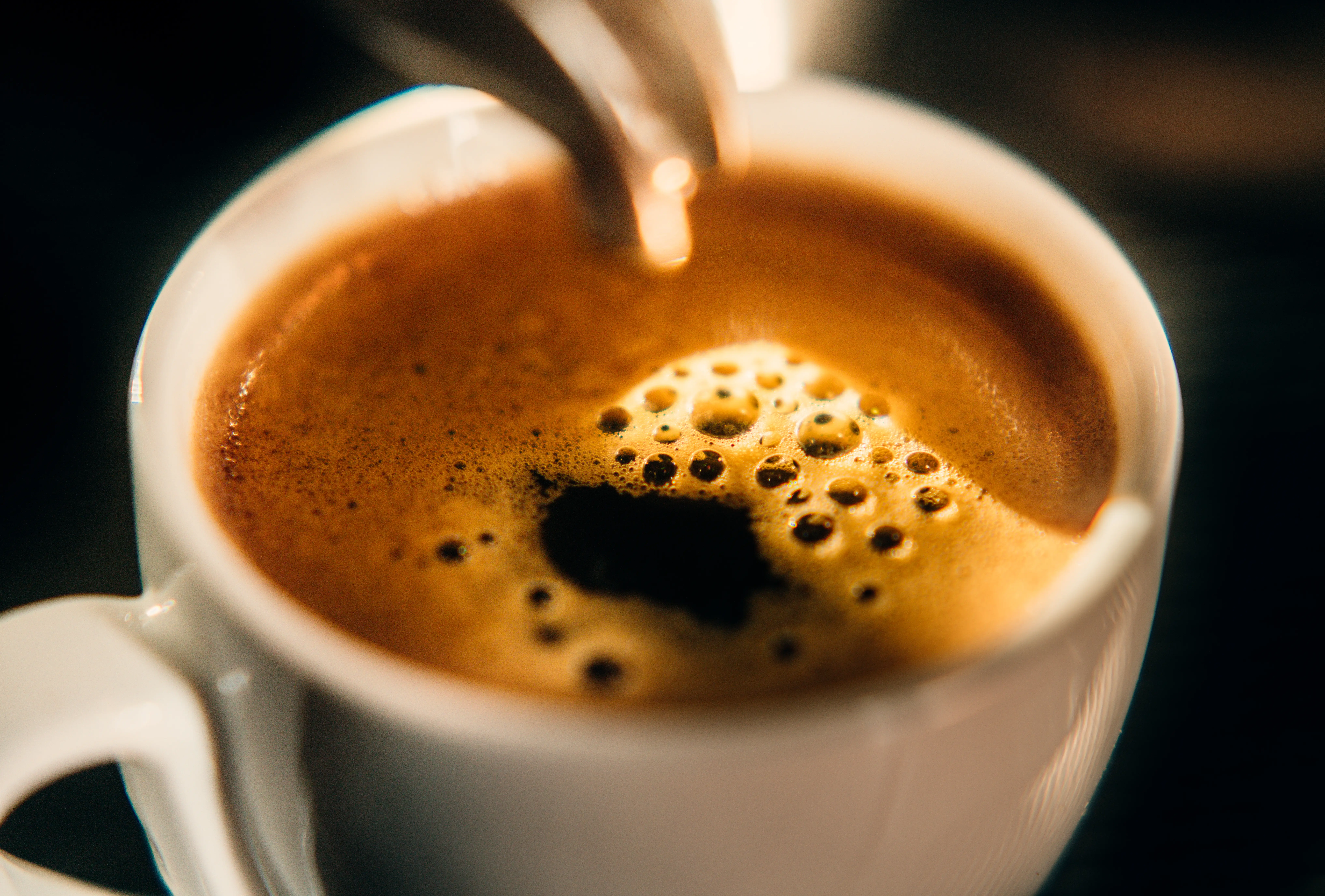 A close up of a fresh cup of espresso coffee