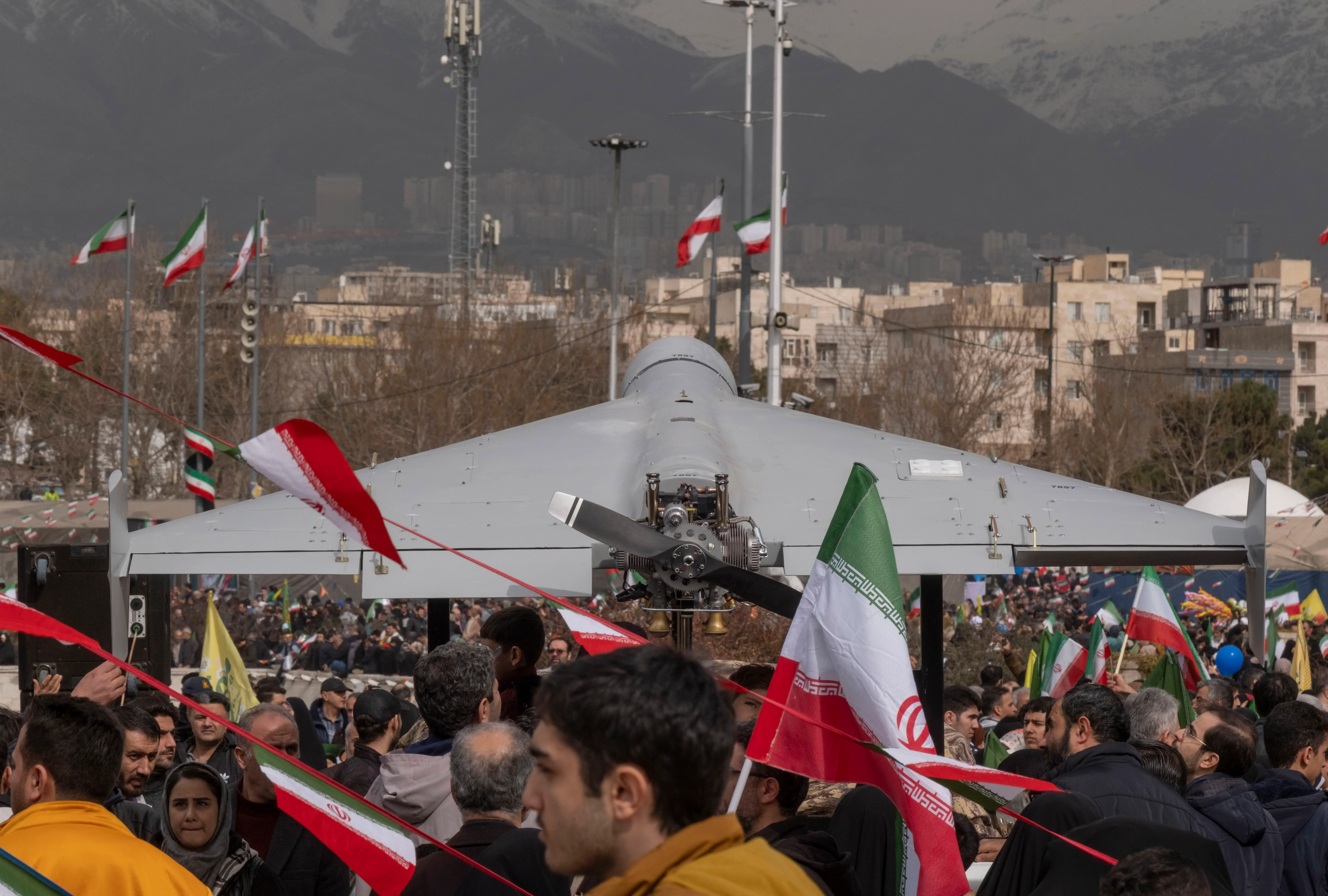 A large grey drone displayed on a crowded street