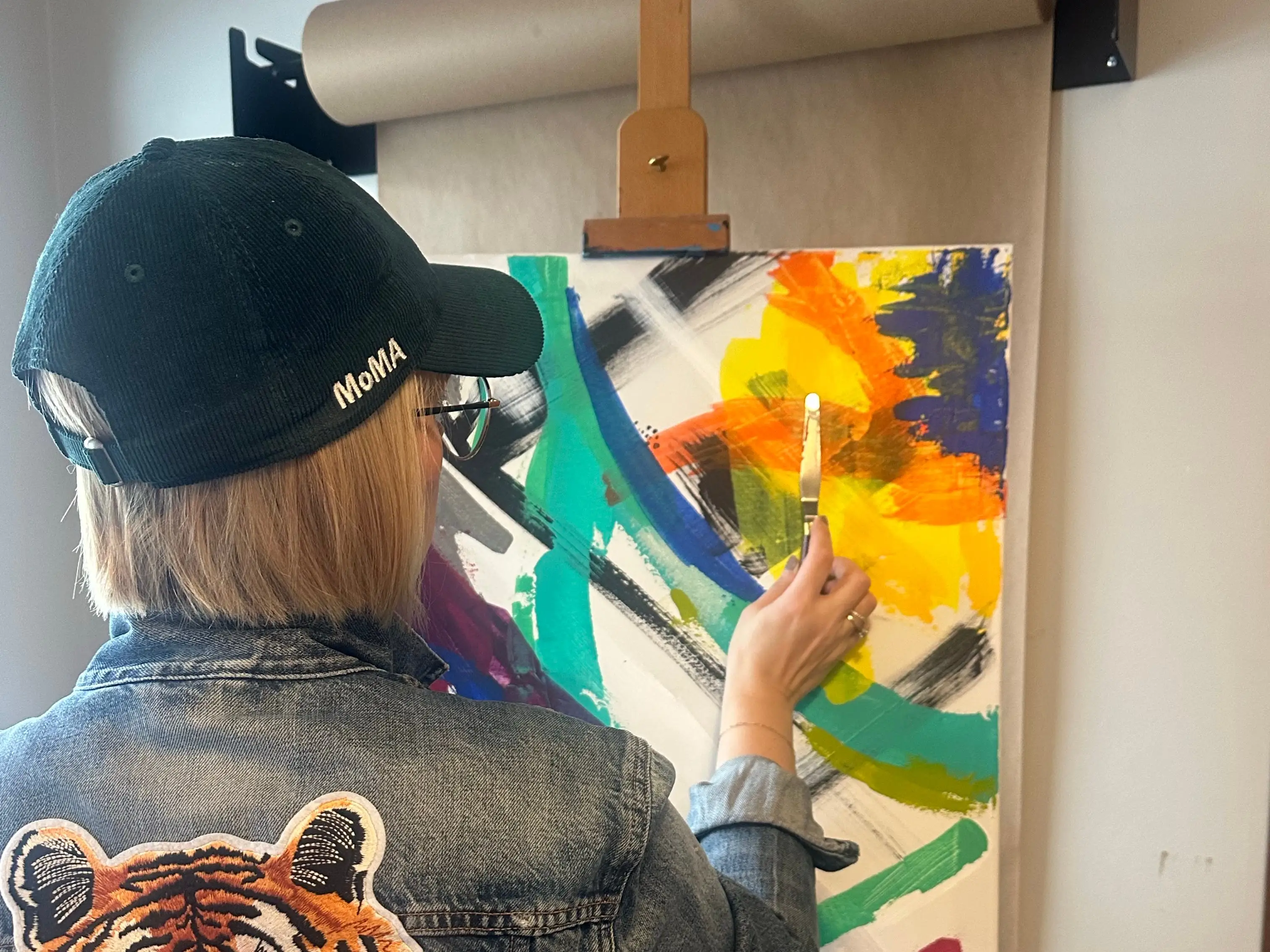 Woman painting canvas