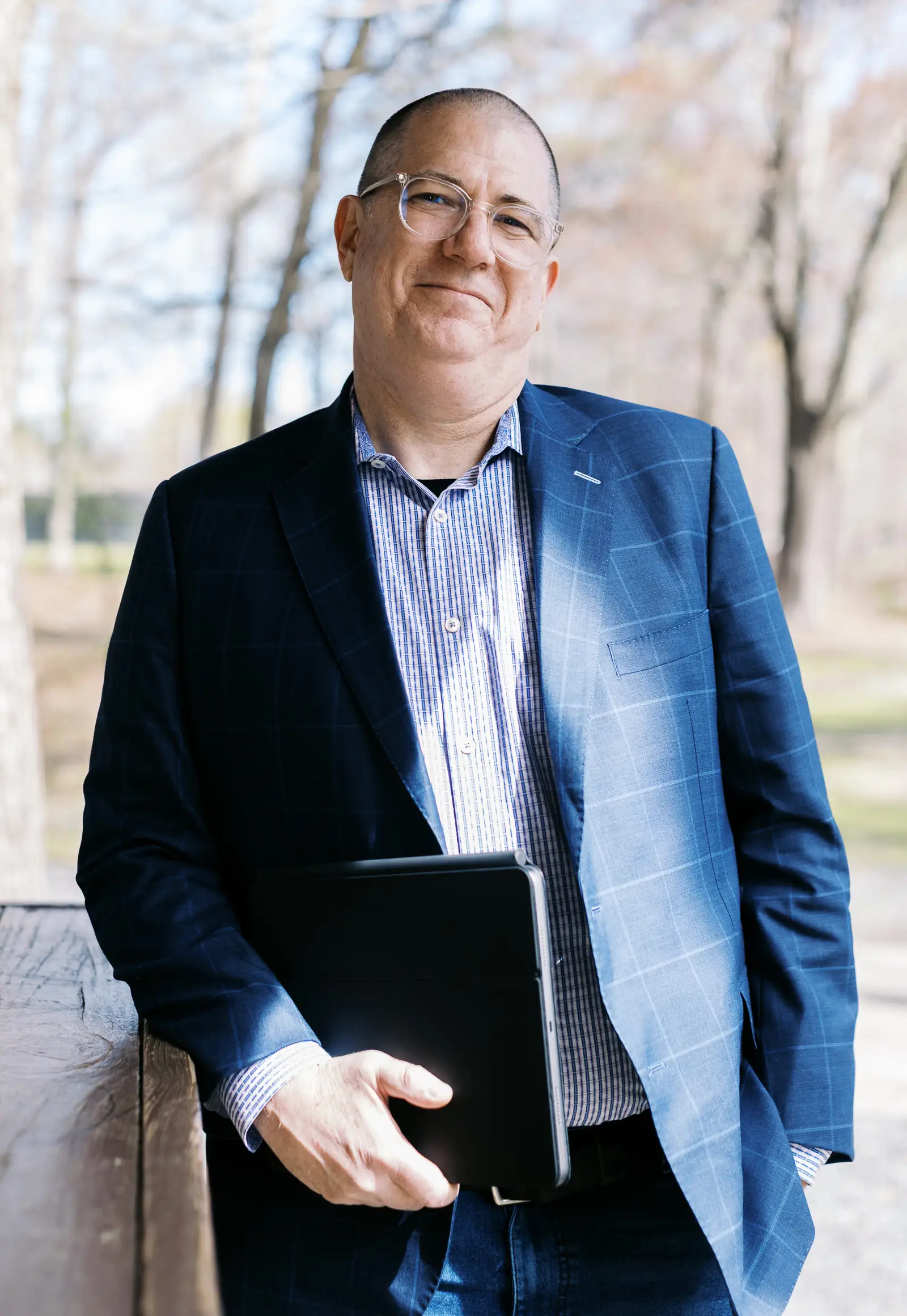 Neon One CEO Keith Reed, posed with his laptop.