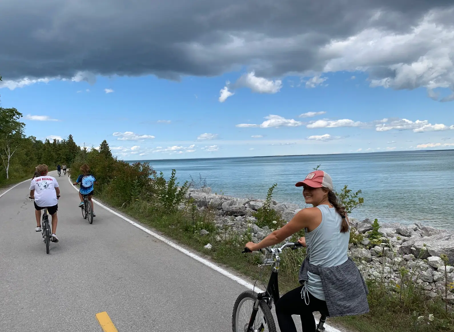 The writer biking down the street on Mackinac Island.