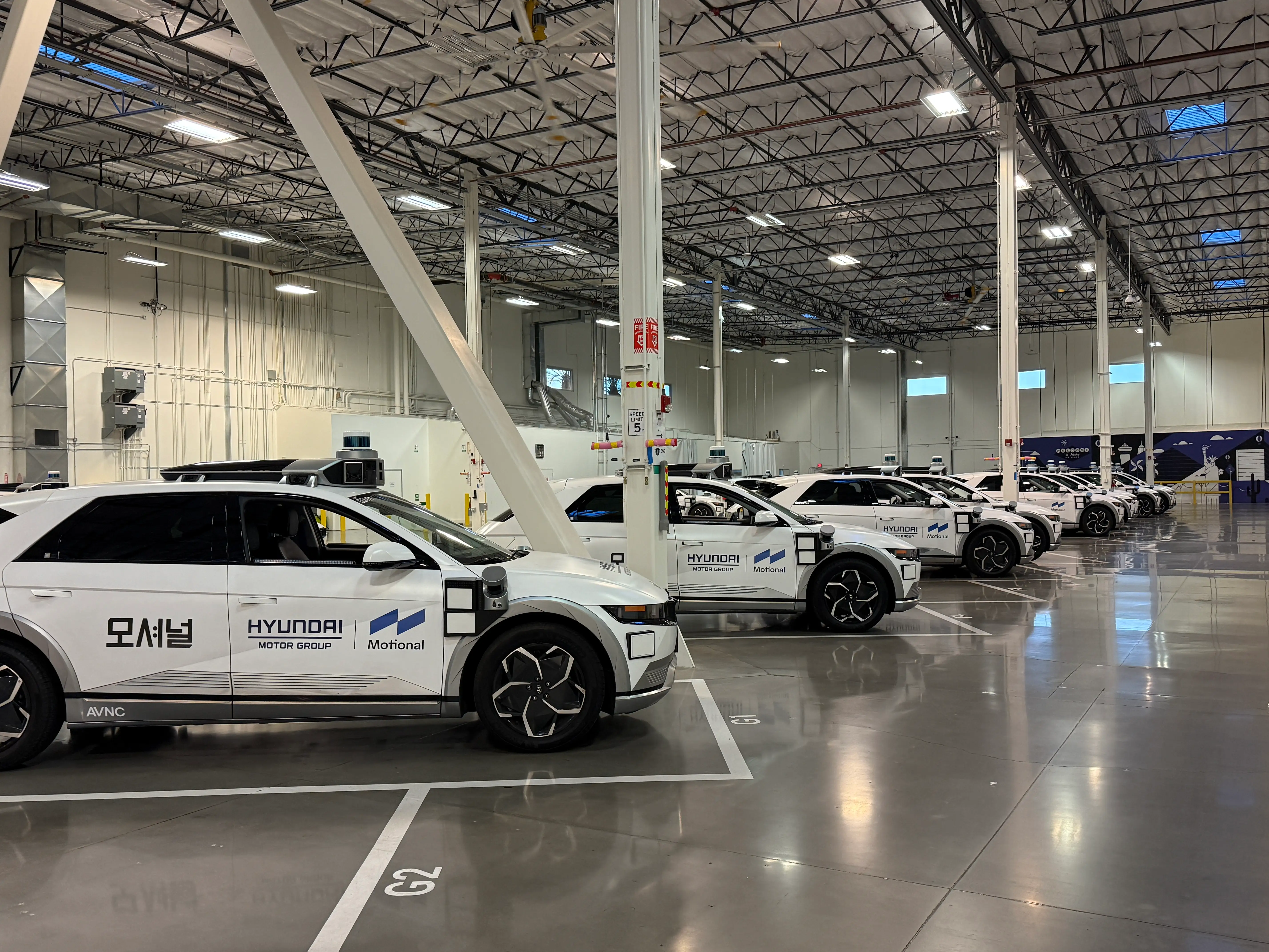 A row of Hyundai robotaxis.