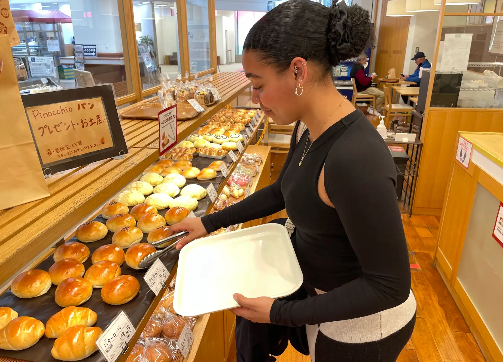 The writer buying pastries in Wakayama.
