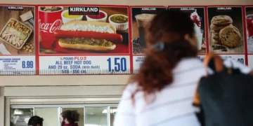 Costco’s CEO chows down on a $1.50 hot dog combo in the latest riff on the McDonald’s burger meme