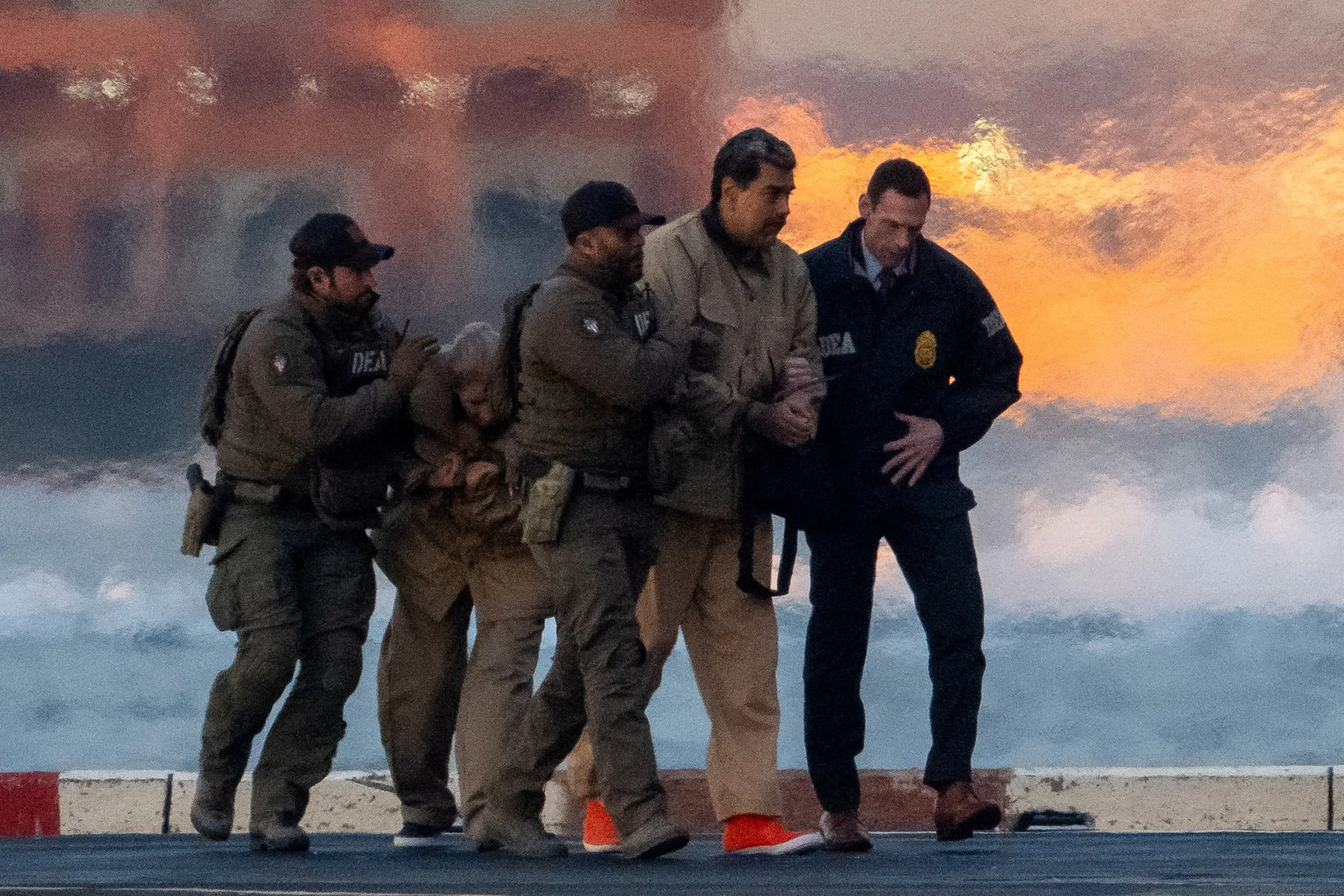 Venezuelan President Nicolas Maduro, and his wife, as they're escorted to court in Manhattan.