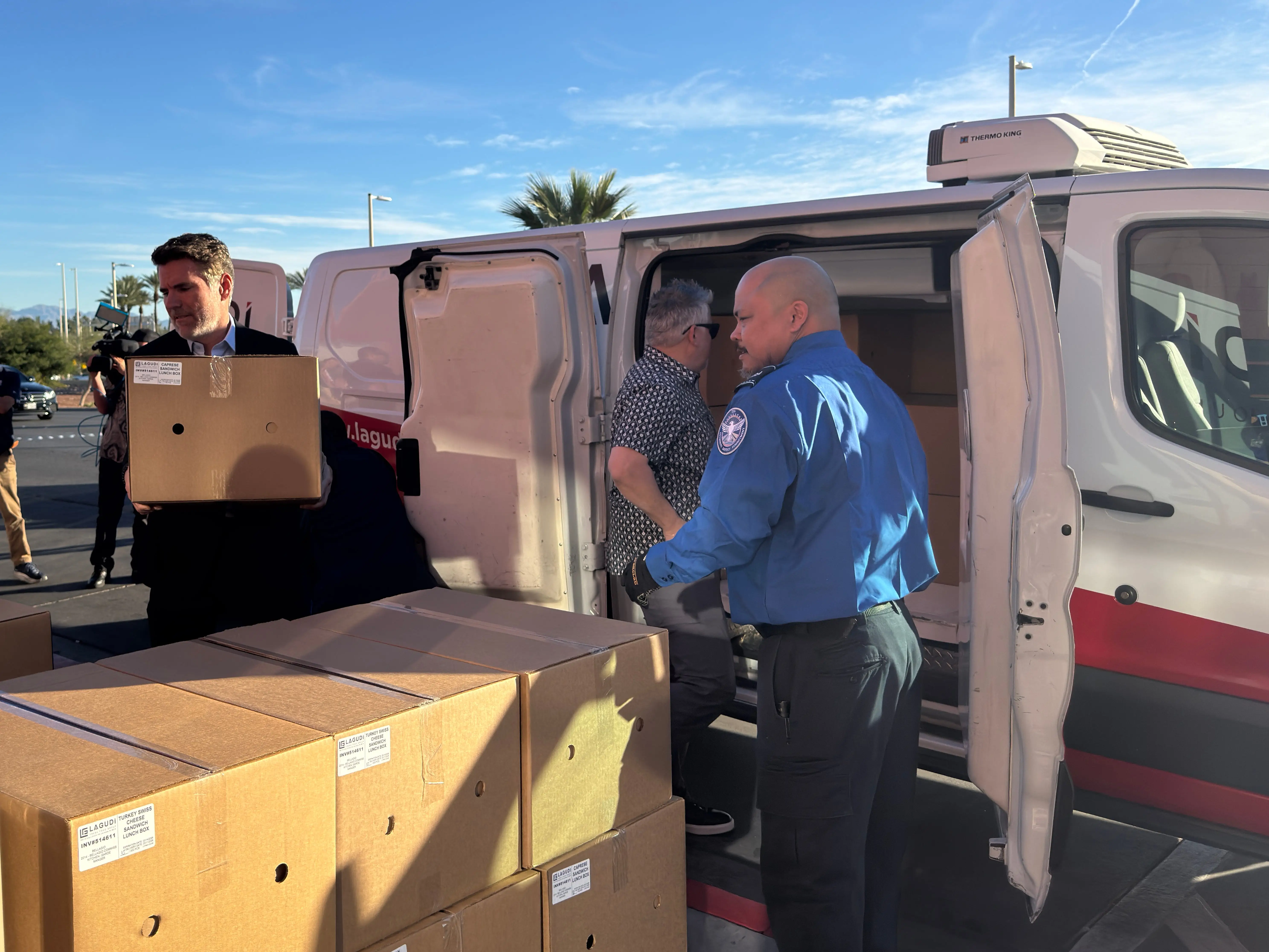 Picture of John Flynn helping unload meals for TSA agents in Las Vegas.