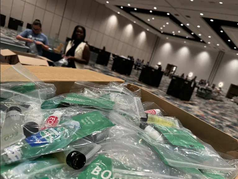MGM volunteers bagging hygiene products for TSA agents.