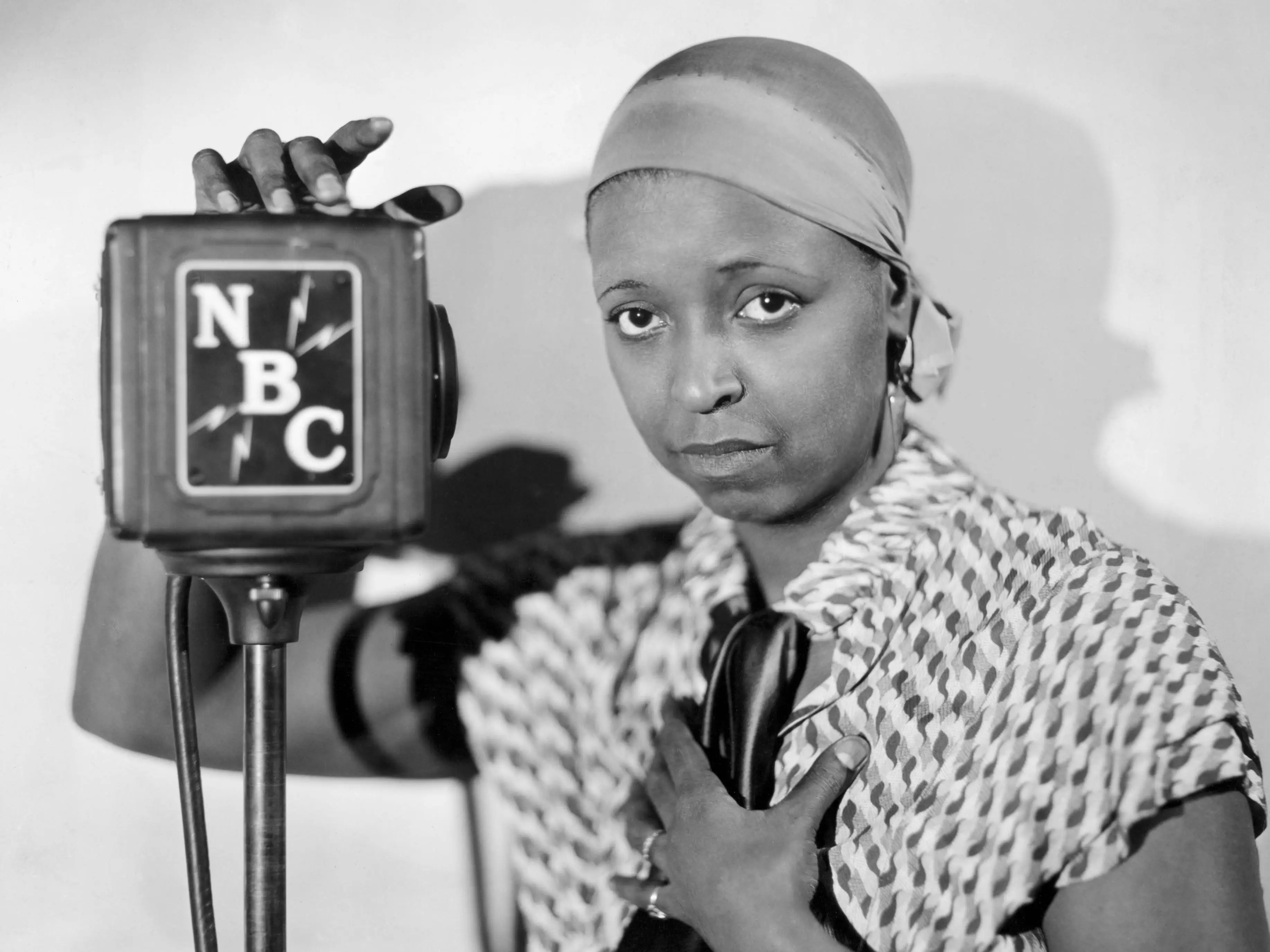 Ethel waters next to an NBC microphone.