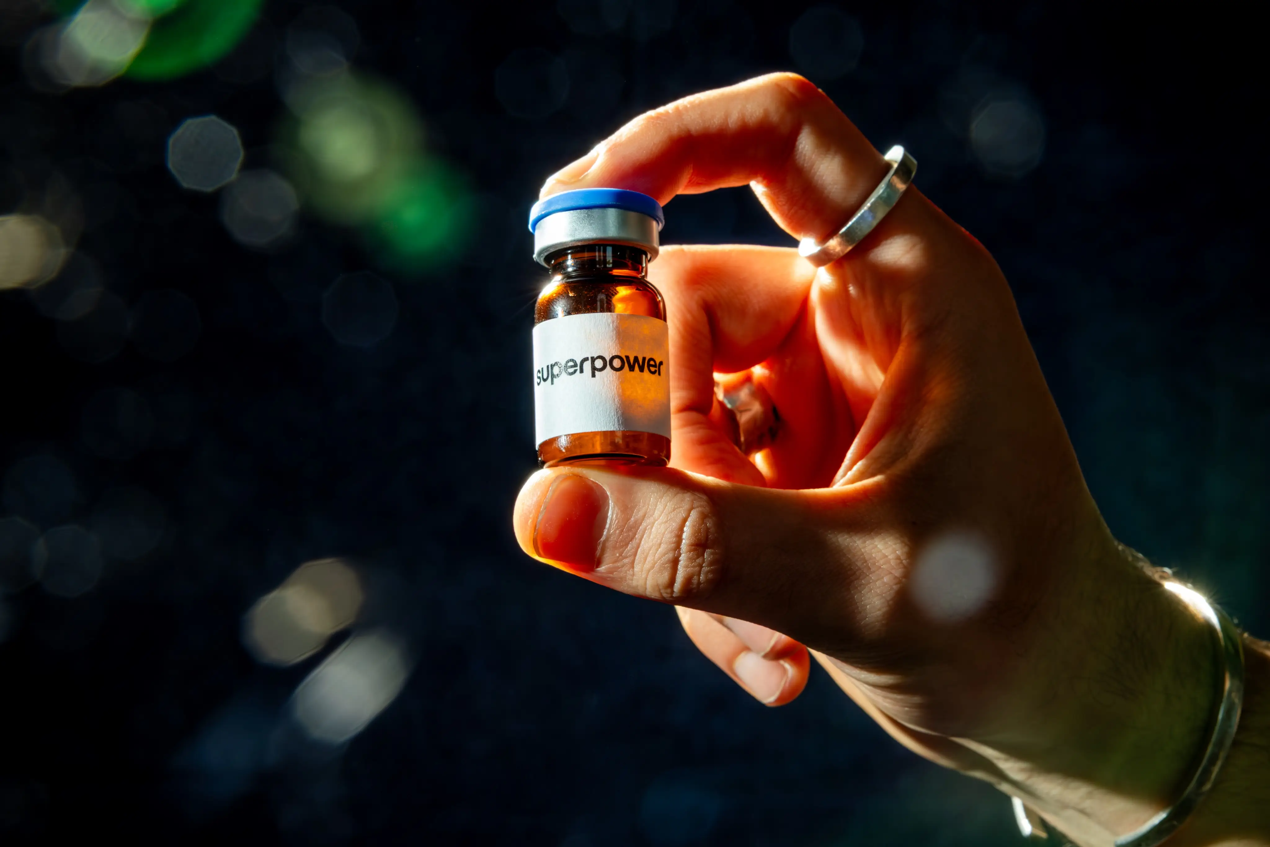 A hand holding peptides labeled