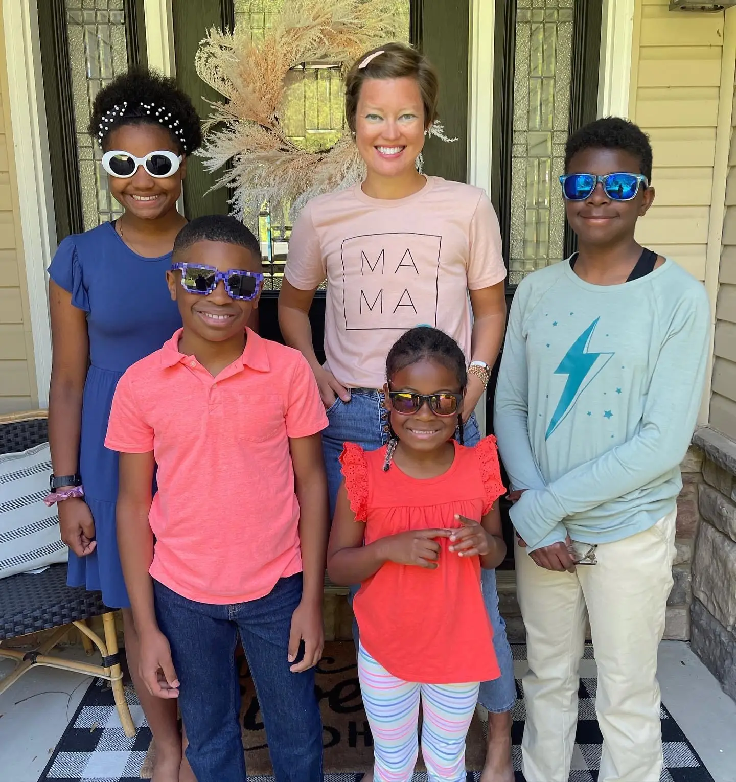 The author poses with her four children.