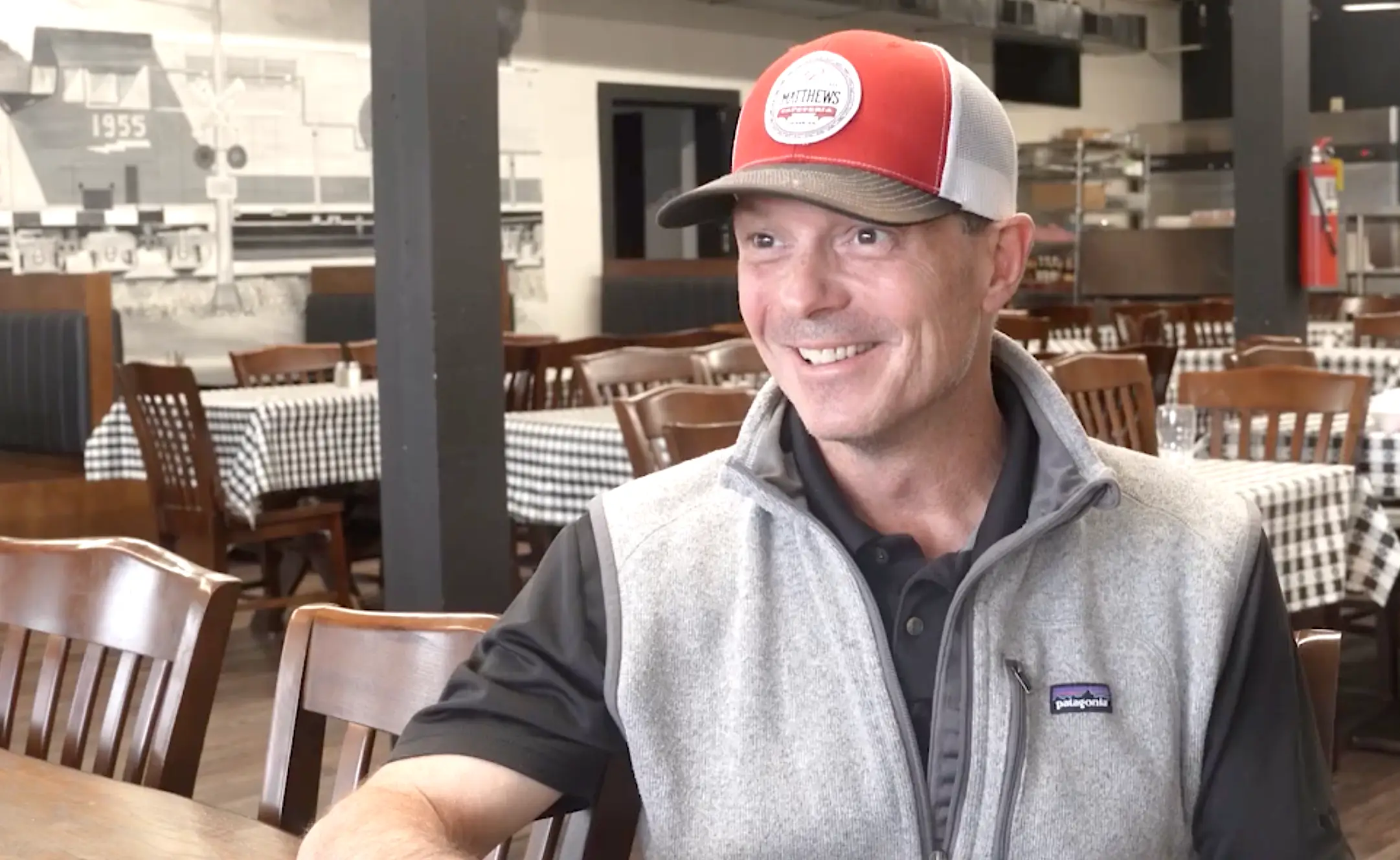Michael Greene sitting in Matthews Cafeteria.