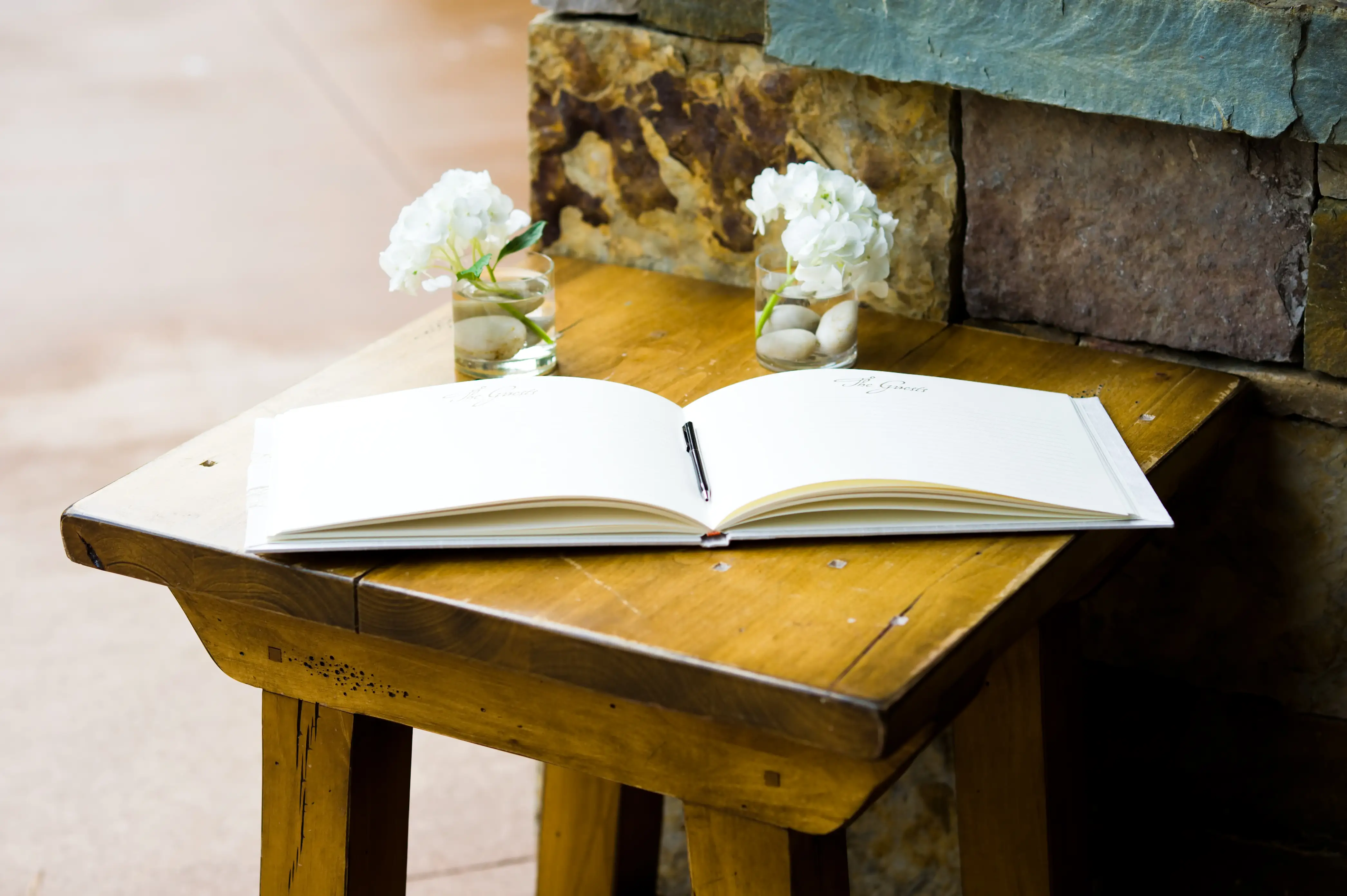 Guest book on table with flowers