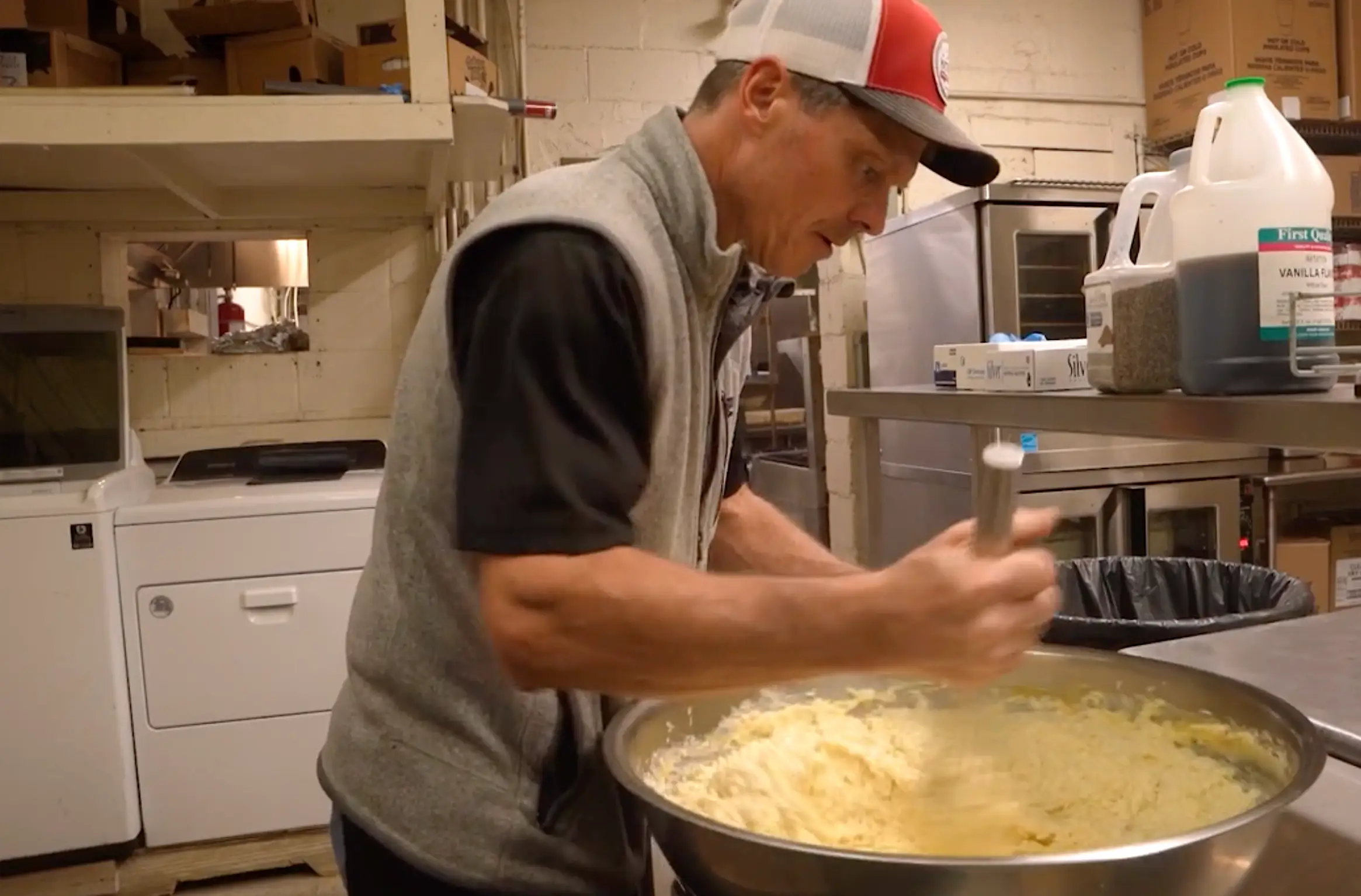 Michael Greene preparing food in Matthew's kitchen.