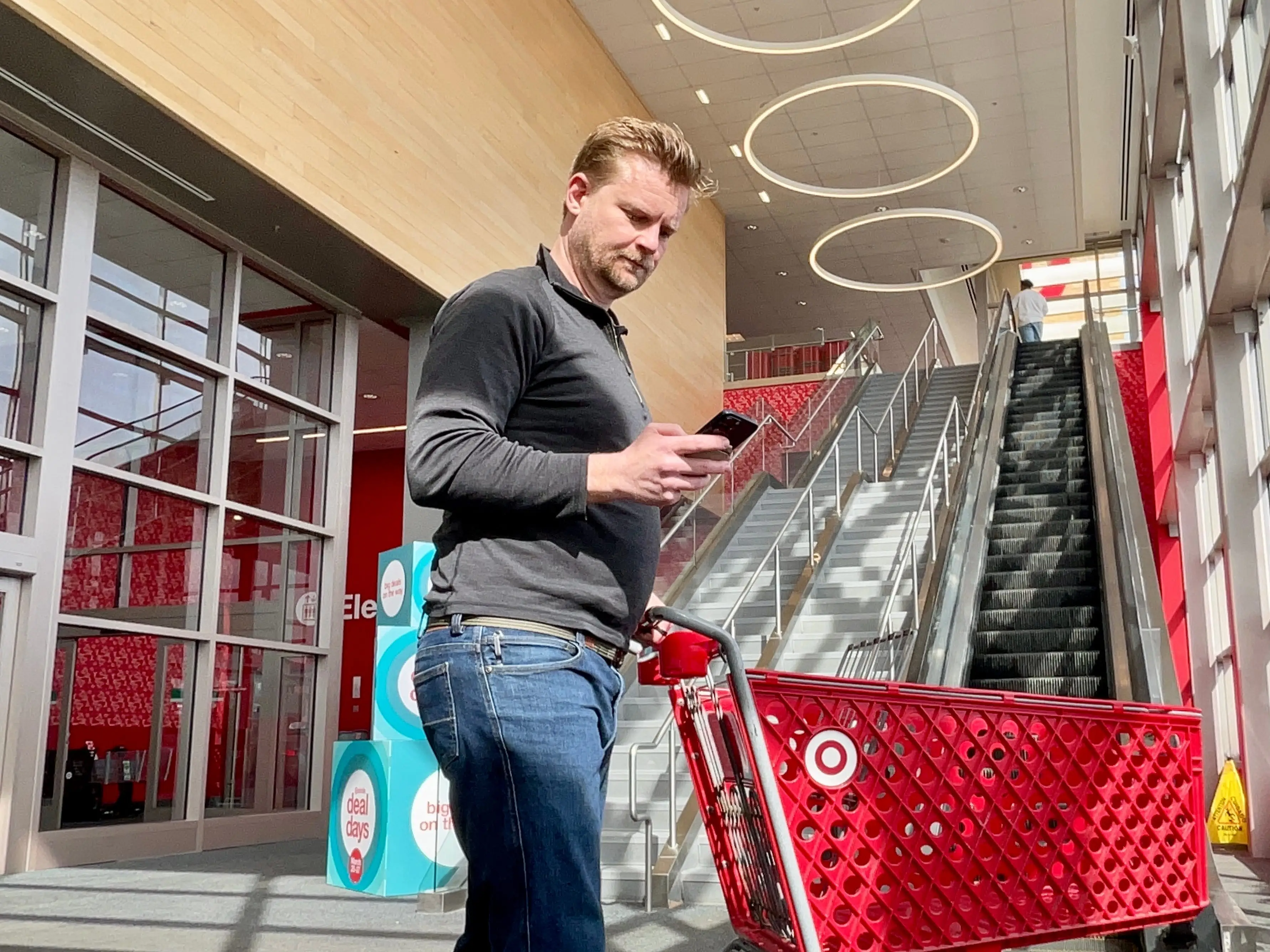 Dominick Reuter looking at the Target app on his iPhone.